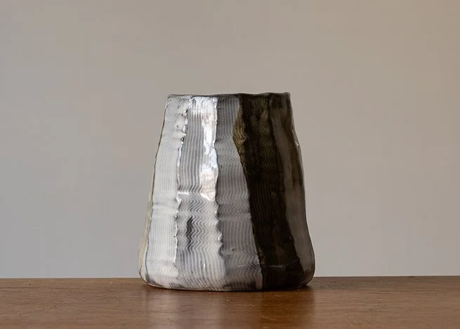 Faceted vase with brown brush marks.jpg