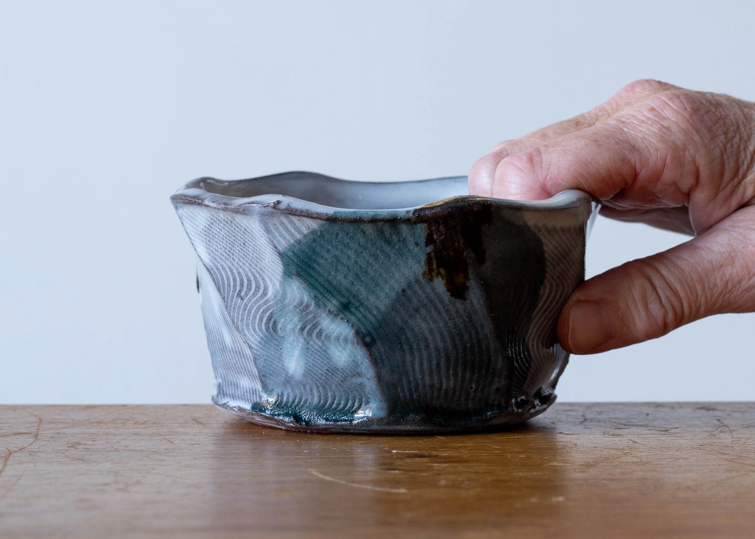Handmade Pottery Faceted Bowl with Turquoise Brush Marks, view 1.jpg