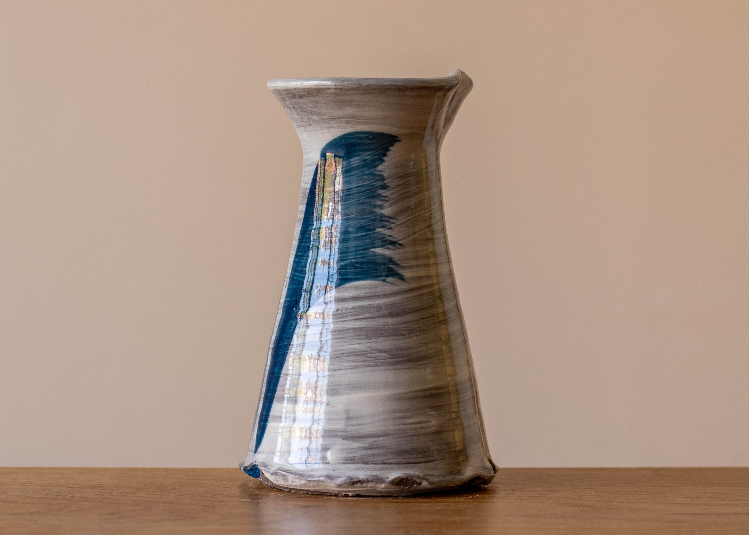 Small handmade stoneware vase with blue brushmarks #5, view of the side.jpg