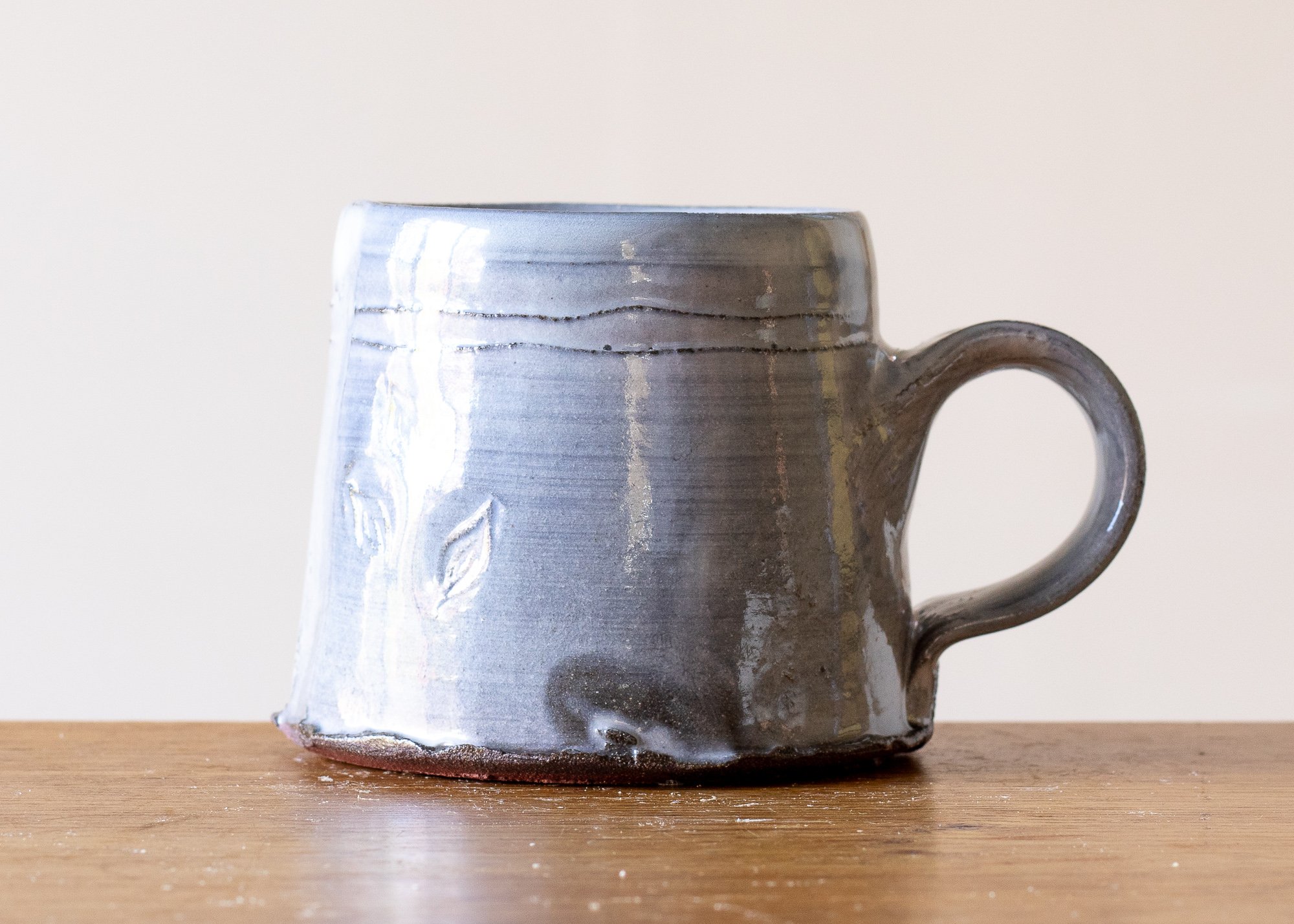 Small Handmade Pottery Coffee Cup with Pale Blue Washed Decoration.jpg