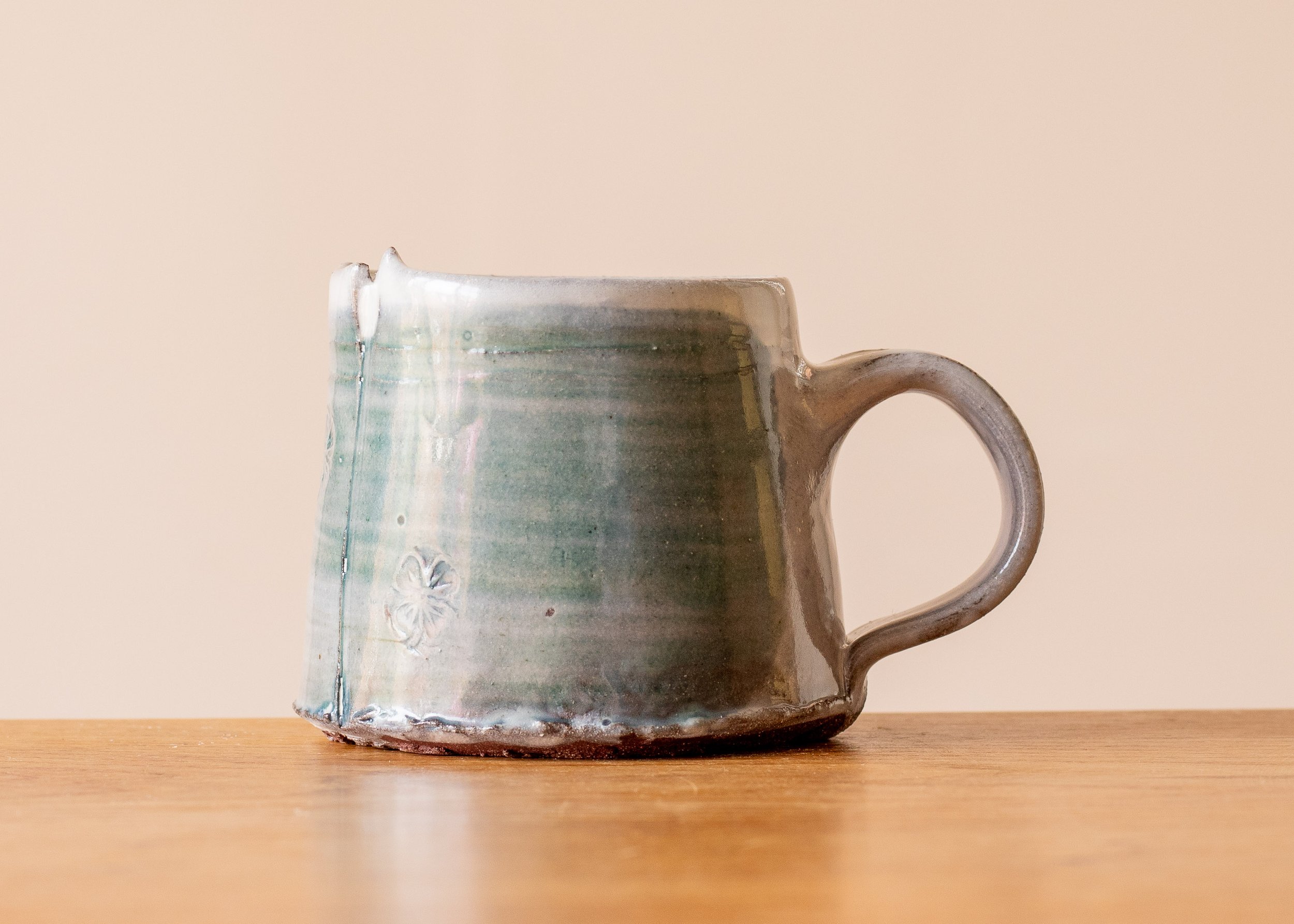 Handmade Pottery Coffee Cup with blue-green and impressed decoration, side 3.jpg