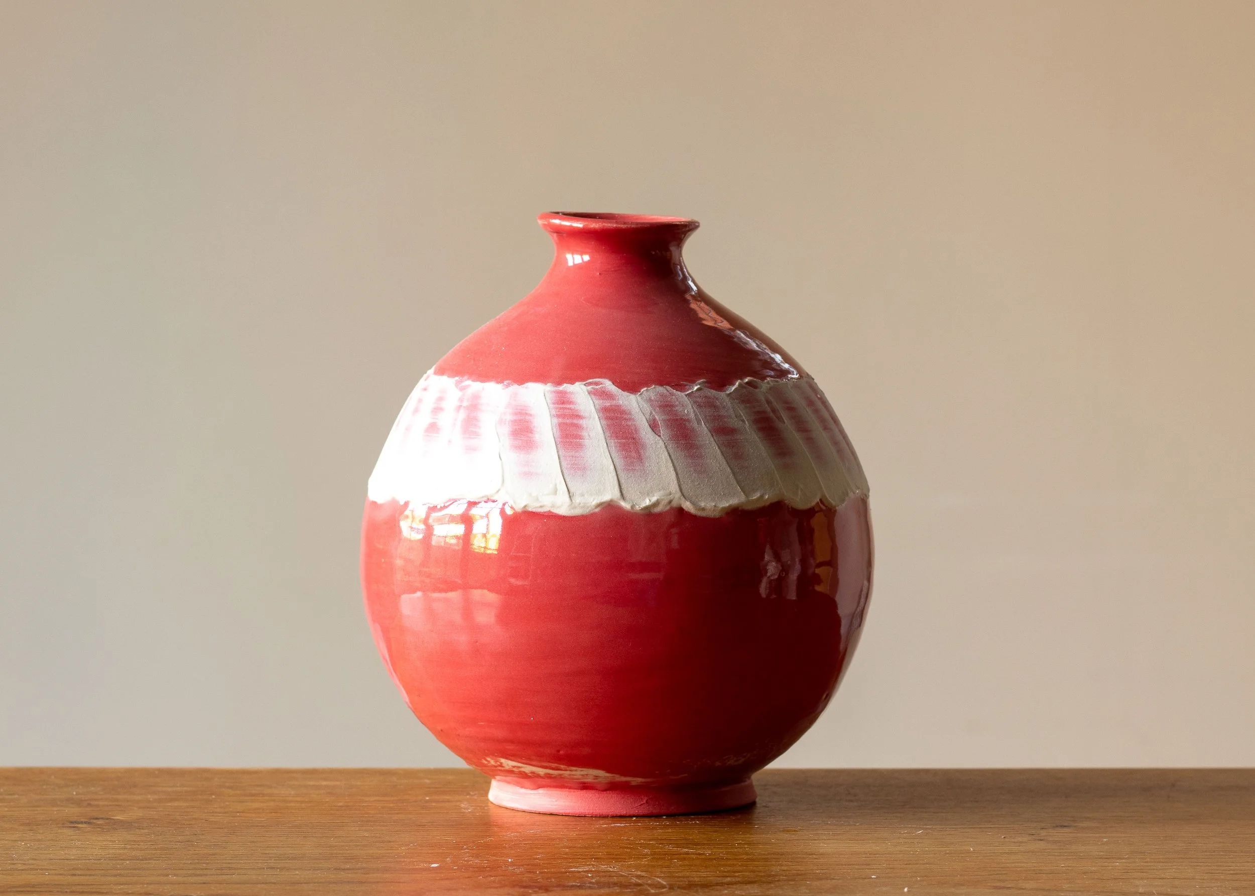 Medium Pale Red Moon Jar with White Decoration, side 2.jpg