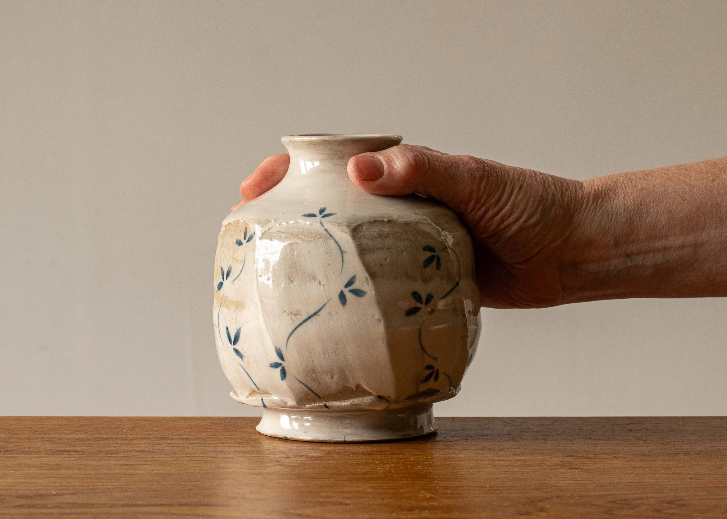 Small White Handmade Pottery Faceted Bottle with Blue Leaf Motif #1