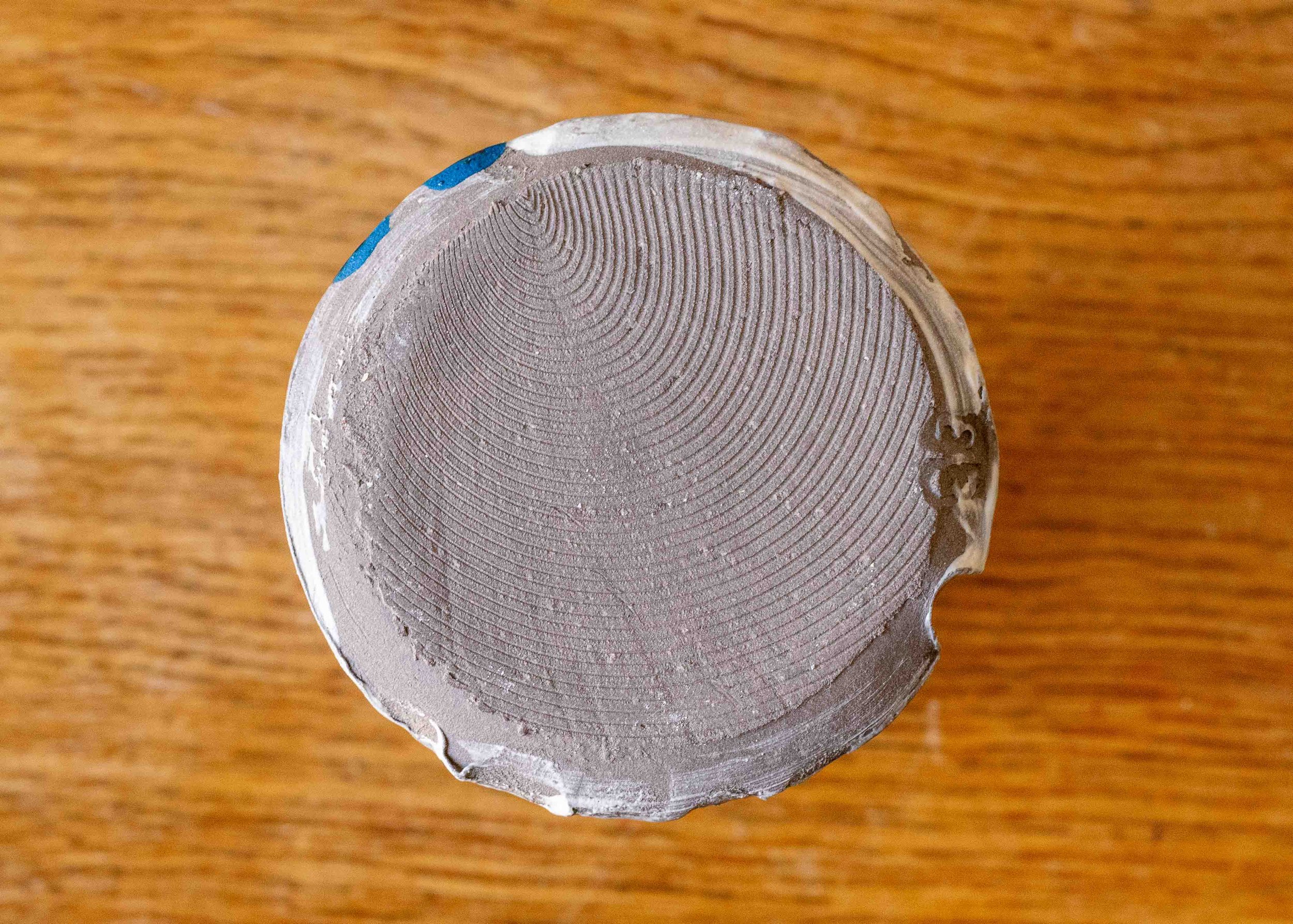 Small handmade stoneware vase with blue brushmarks #5, view of the base.jpg