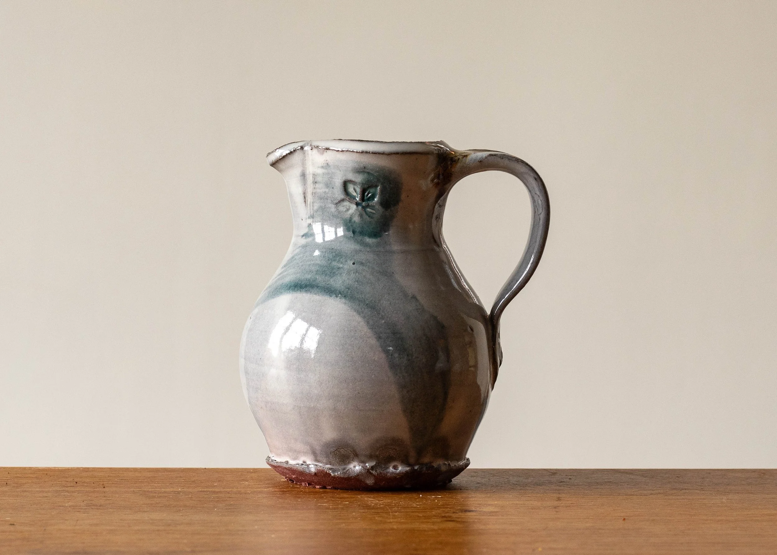 Small Handmade Pottery Jug with Green Brush Mark, view 1.jpg
