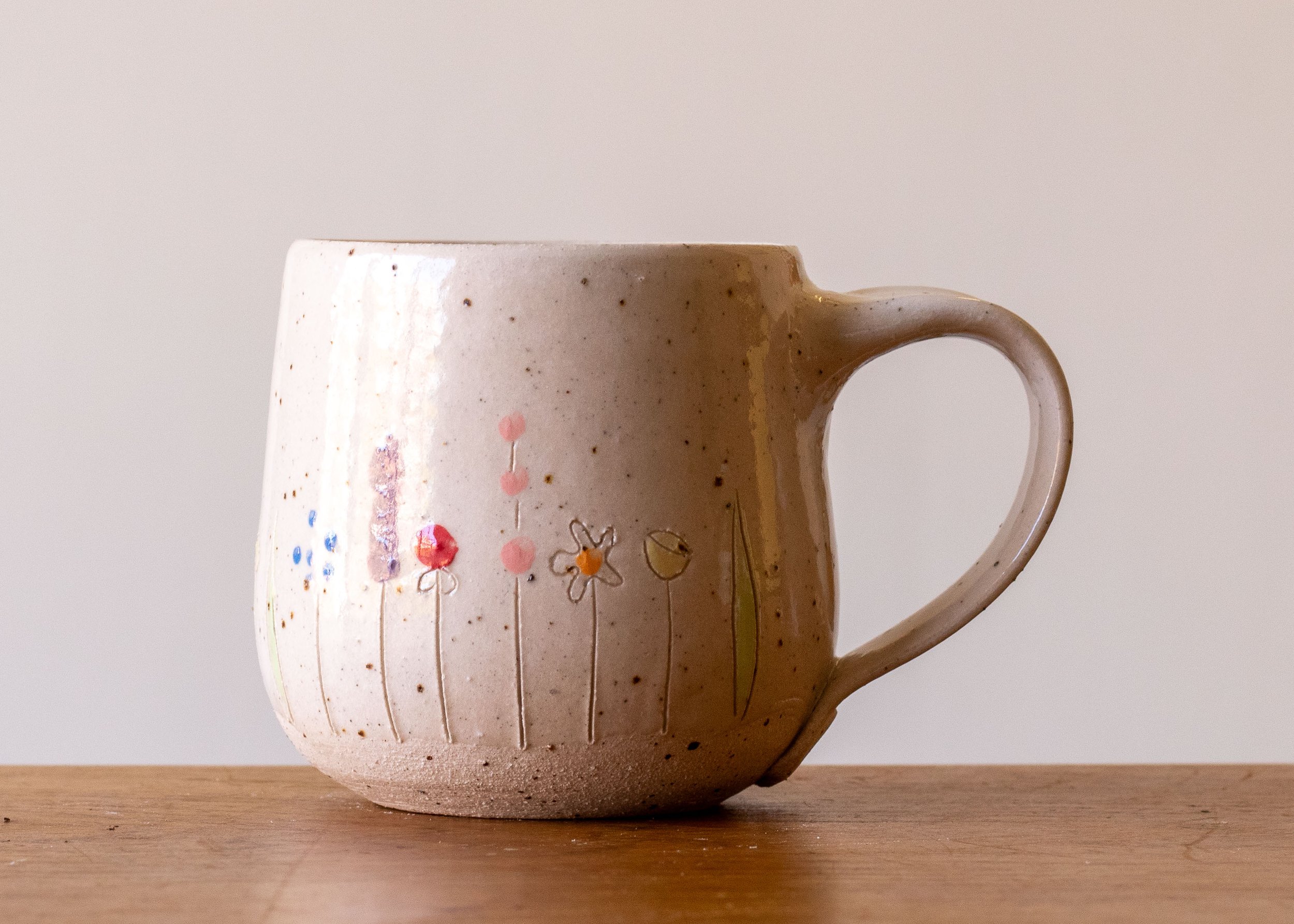 White Handmade Pottery Mug with Midsummer Flower Design.jpg
