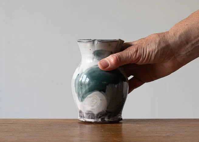 Bud Vase with Turquoise brush marks, with hand for scale.jpg