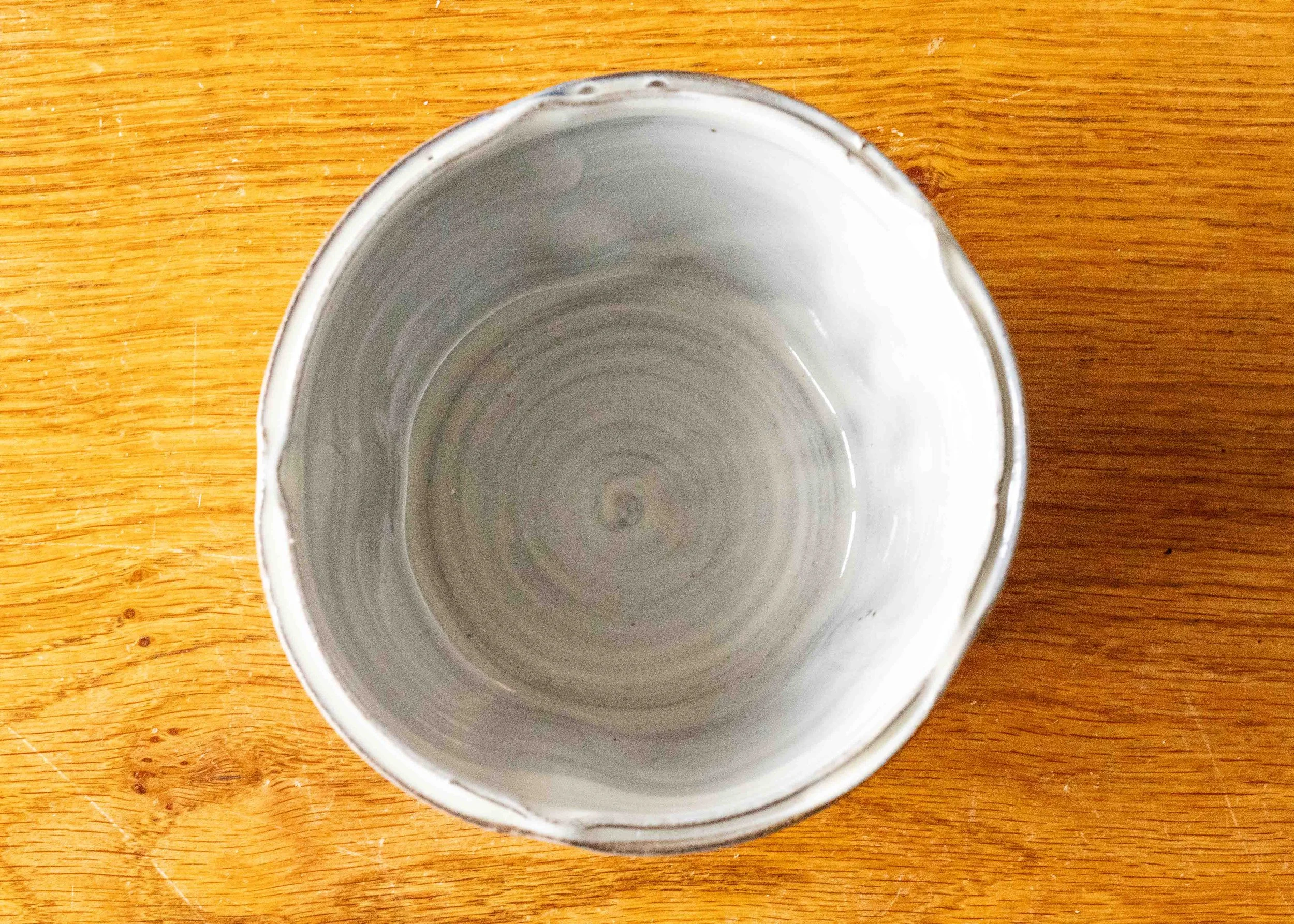 Small white bowl with blue brush marks, view of the inside.jpg