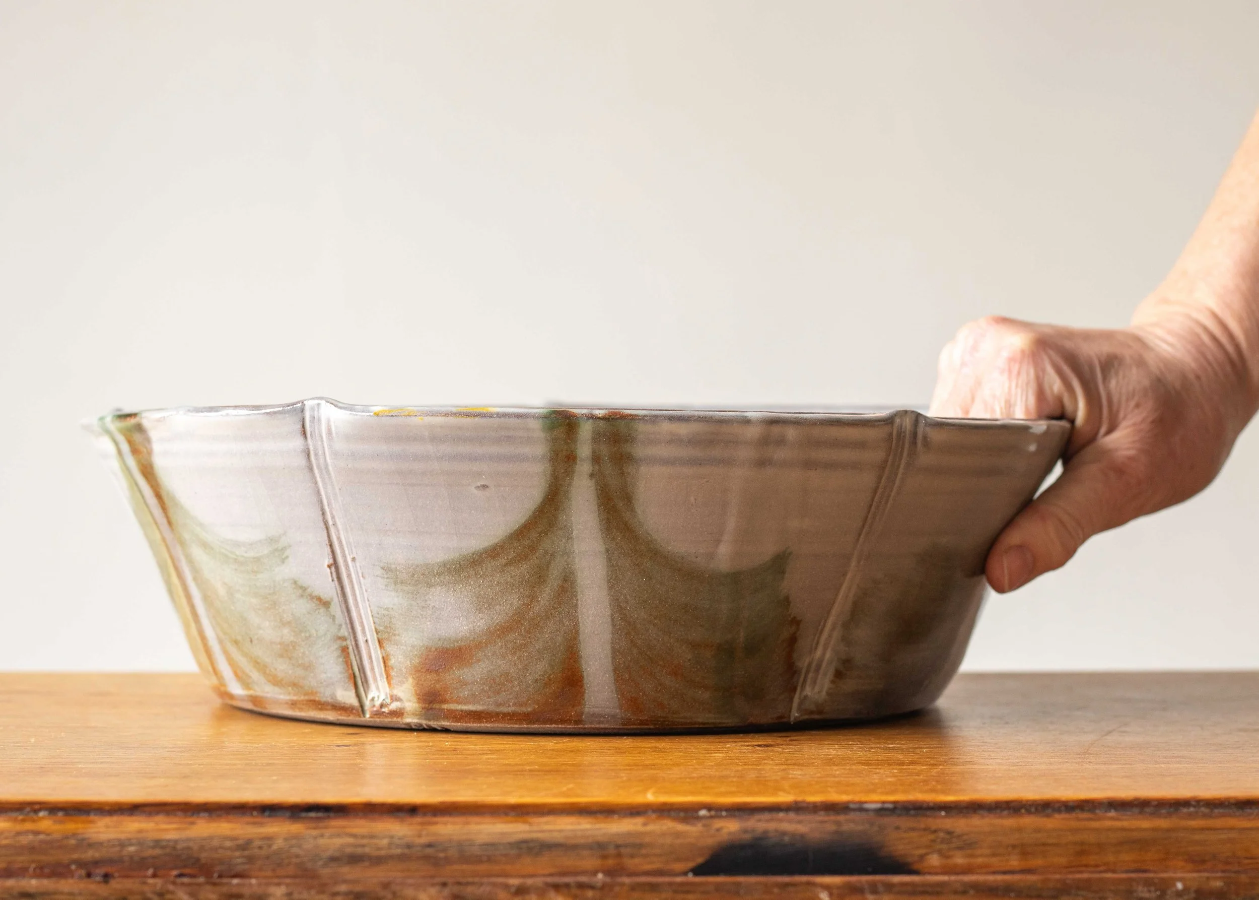 Large Bowl with Green Decoration, with hand for scale.jpg