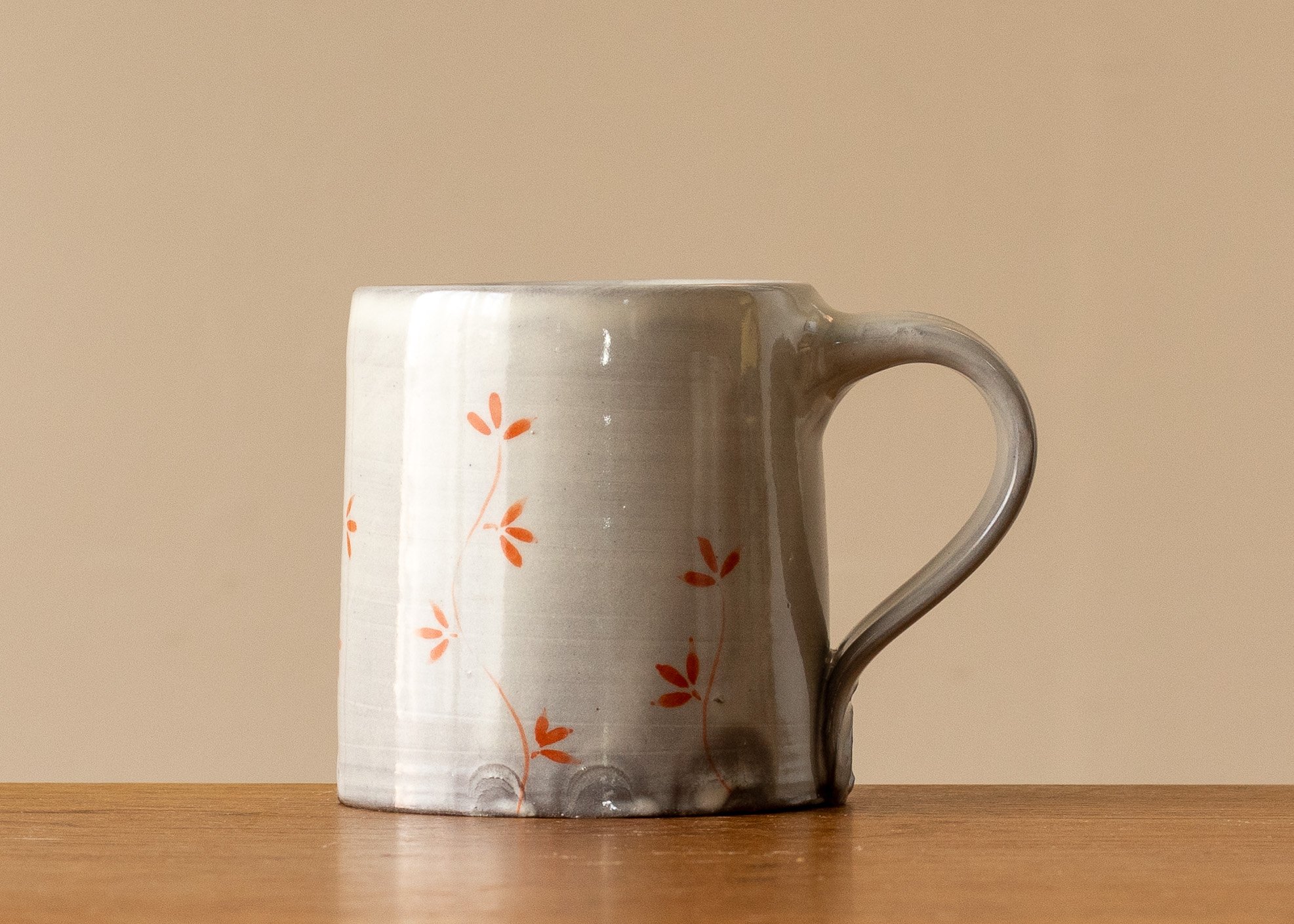 Small handmade pottery mug with Autumn Leaf decoration, view of side 1.jpg
