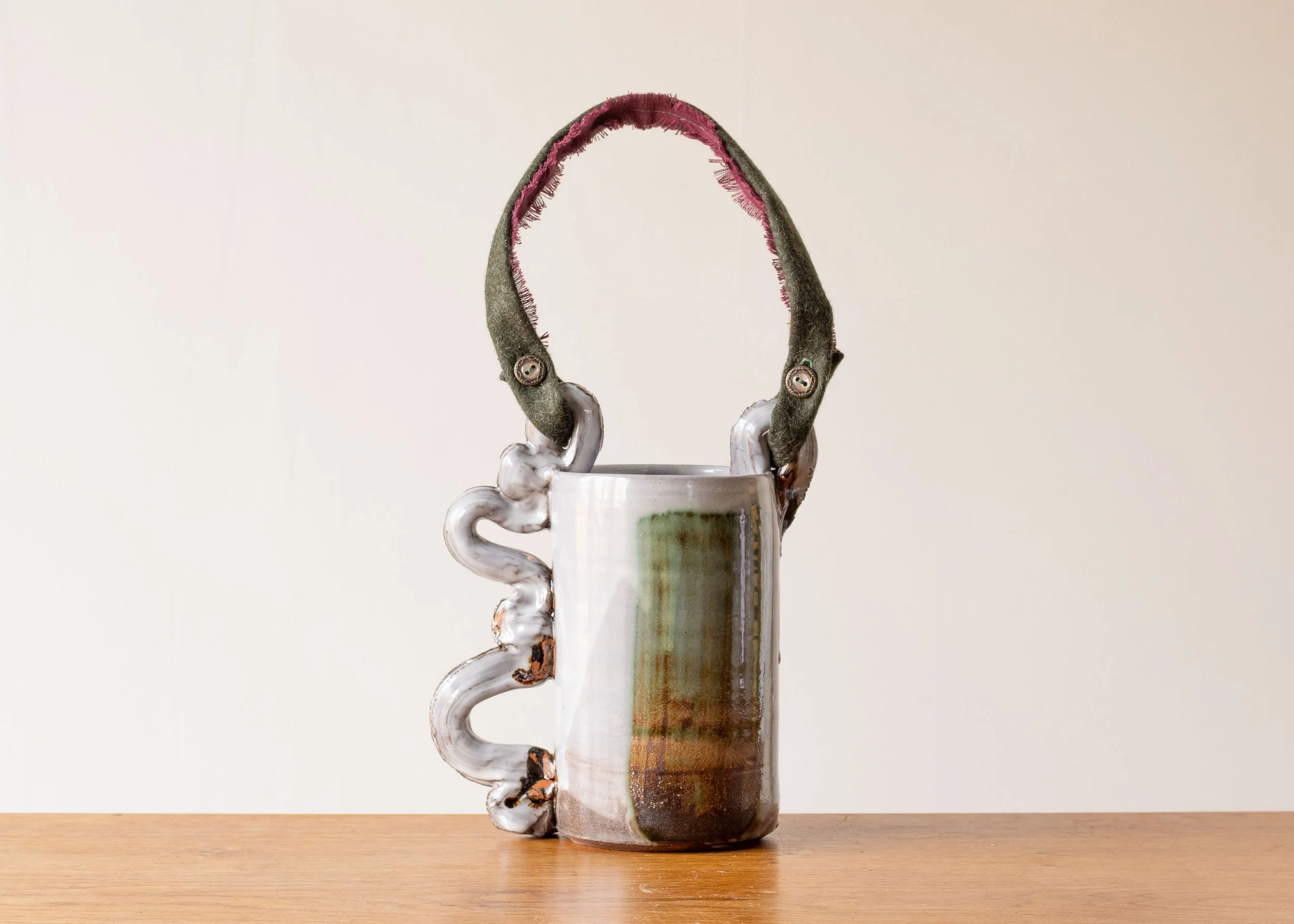 Decorative vessel with textile handle, view 2.jpg