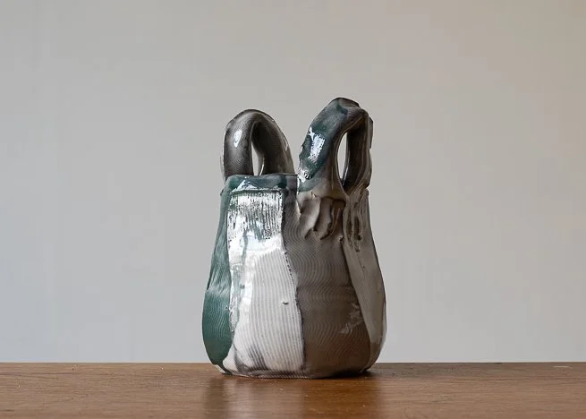Faceted vase with turquoise brush marks.jpg