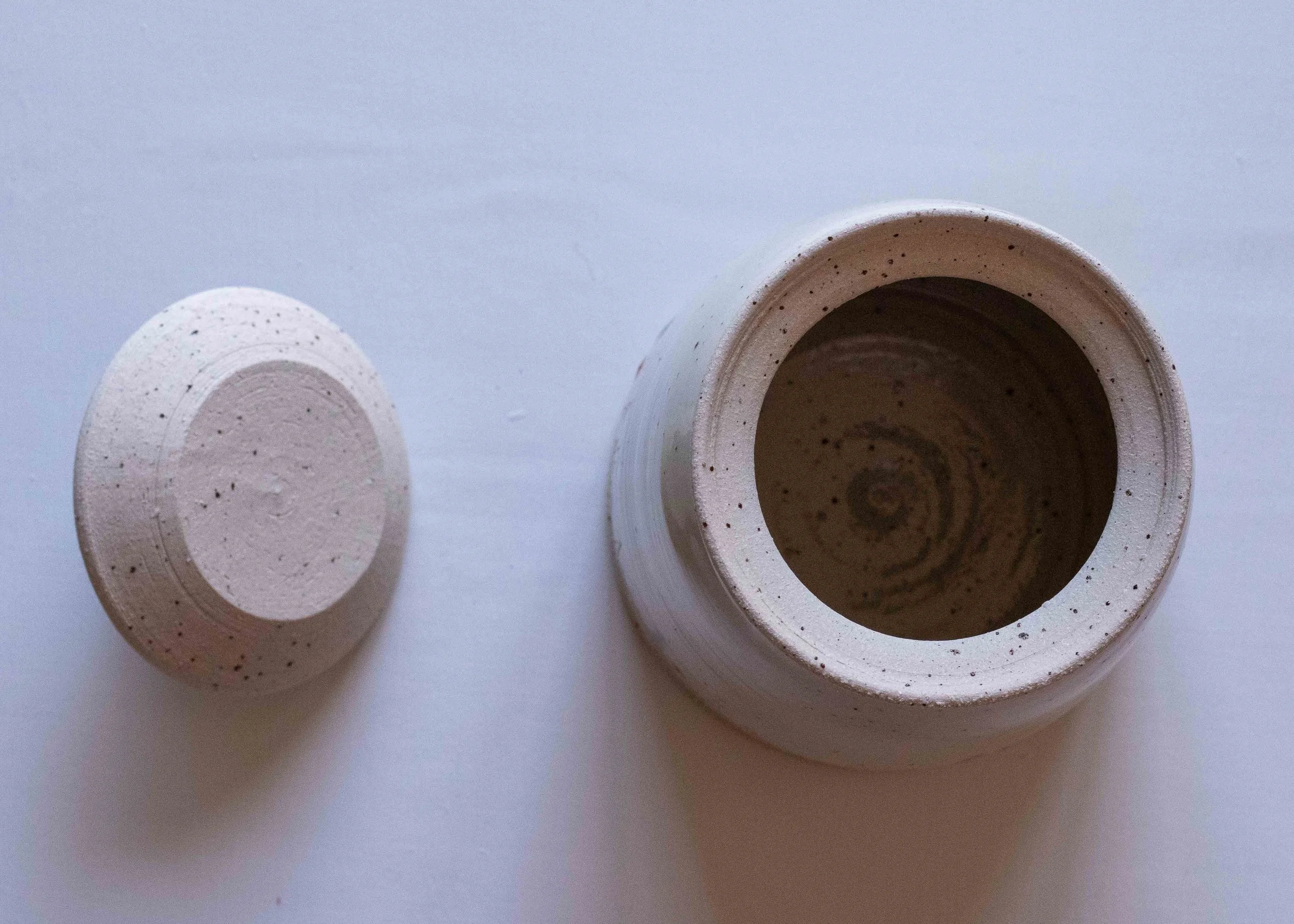 White Handmade Pottery Lidded Jar with Midsummer Flower Design, view of the inside.jpg