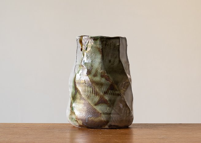 Faceted vase with green brush marks.jpg