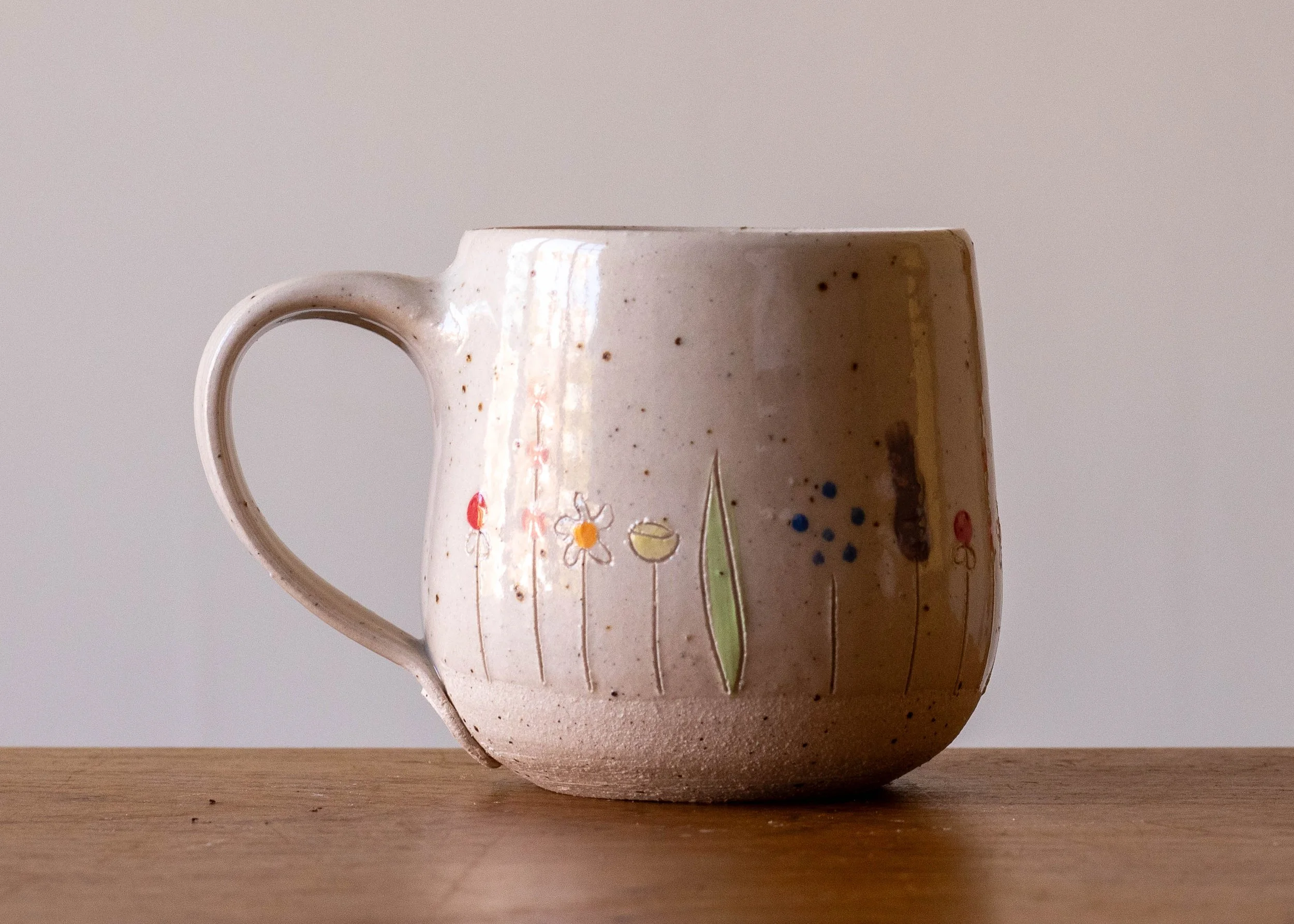 White Handmade Pottery Mug with Midsummer Flower Design, view 3.jpg