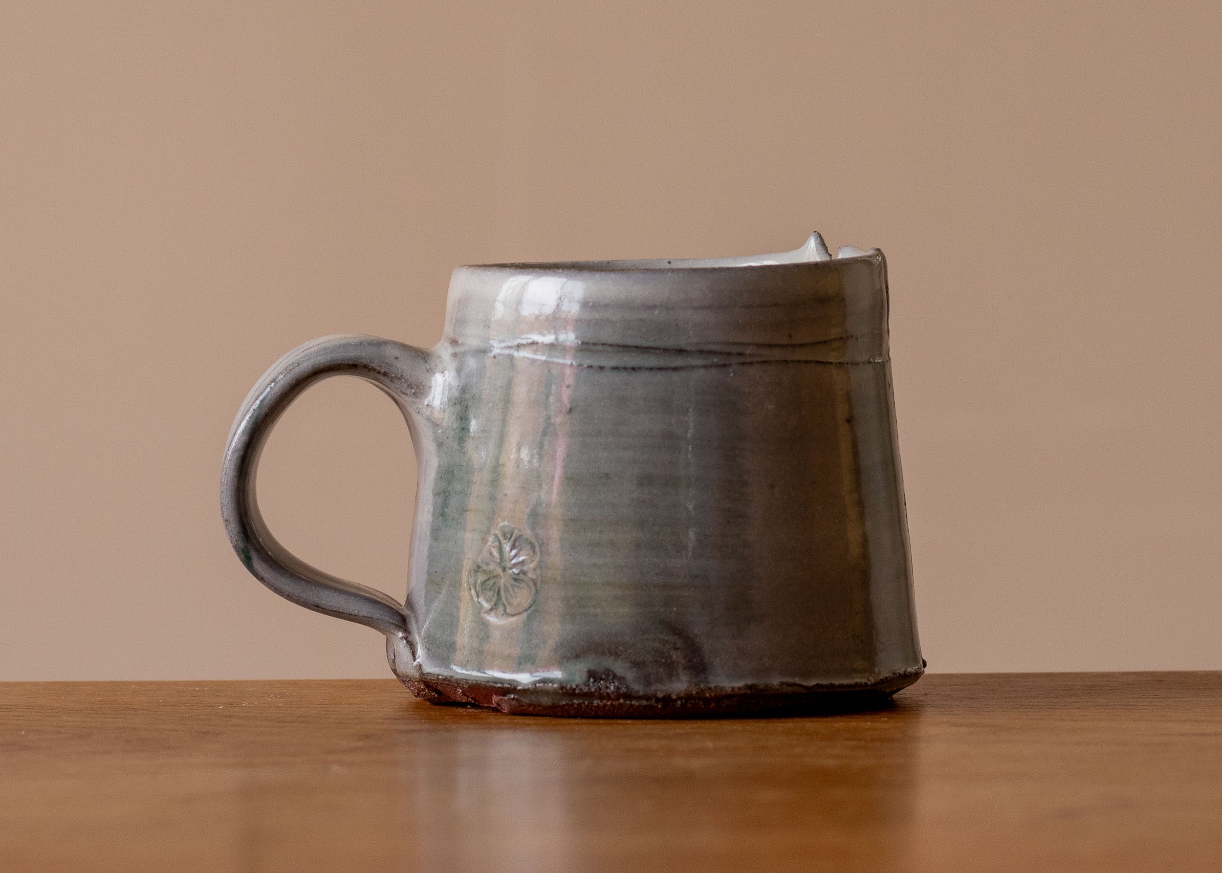 Handmade Pottery Coffee Cup with blue-green and impressed decoration.jpg