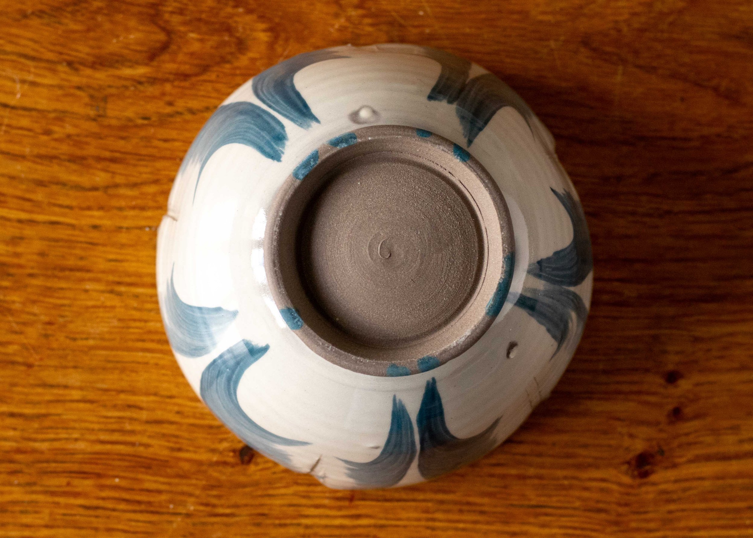 Handmade thrown and altered bowl with blue brushed decoration, view of the base #2.jpg