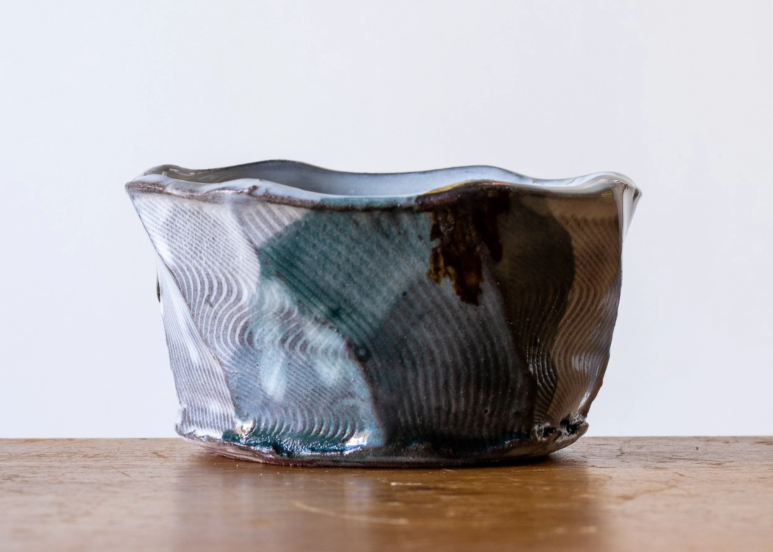 Handmade Pottery Faceted Bowl with Turquoise Brush Marks, view 2.jpg