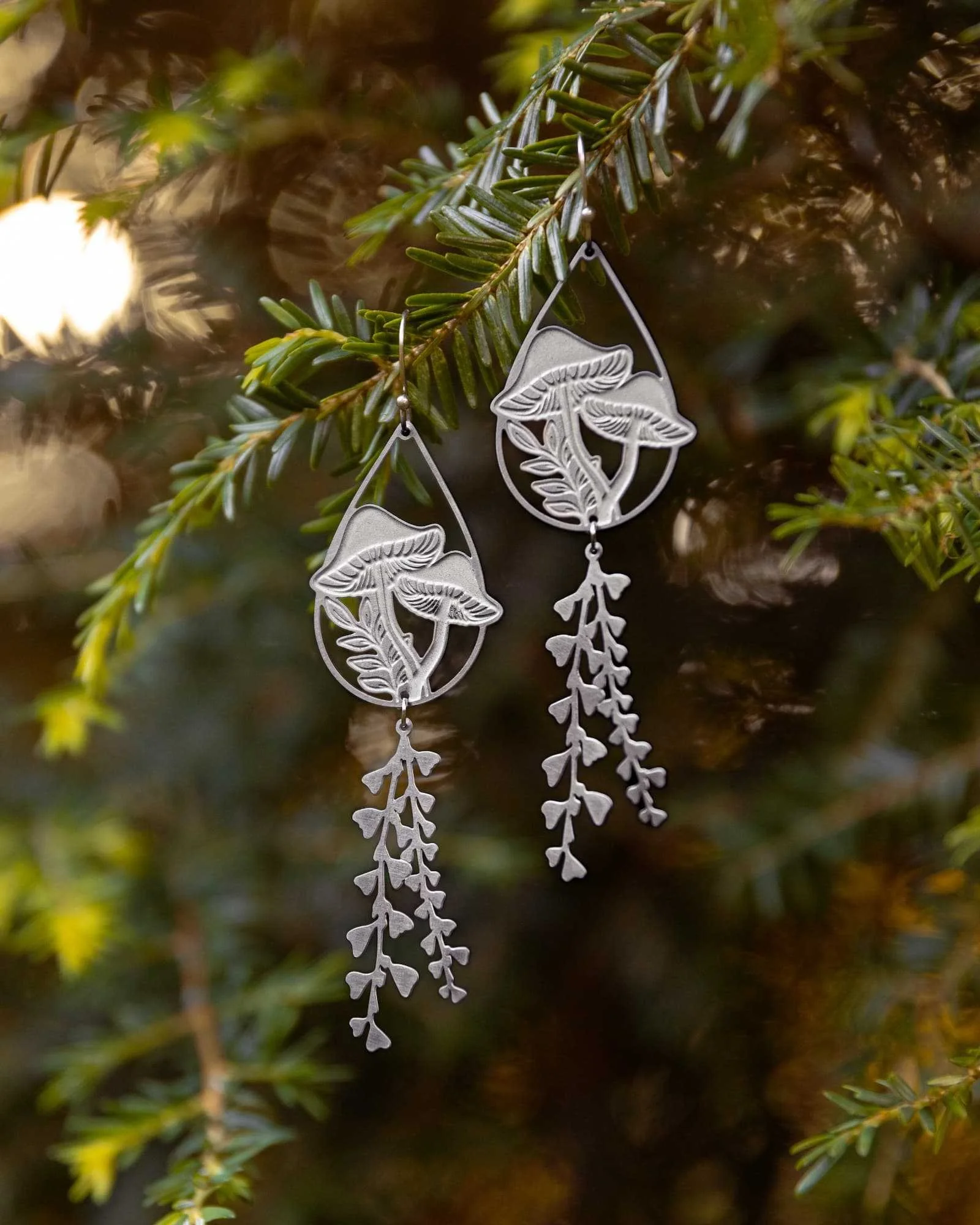 interconnected-sustainably-eco-ethically-handmade-silver-mushroom-statement-earrings-portrait.jpg