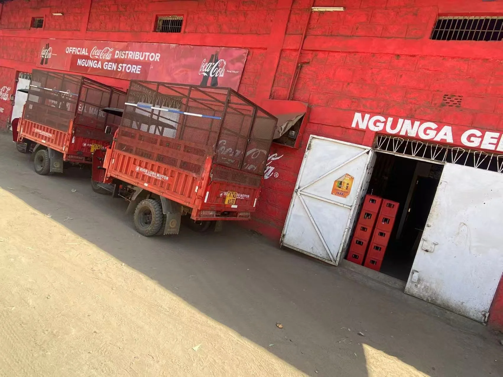 Transfer three wheeled truck at the entrance of Coca Cola warehouse in Nairobi, Kenya