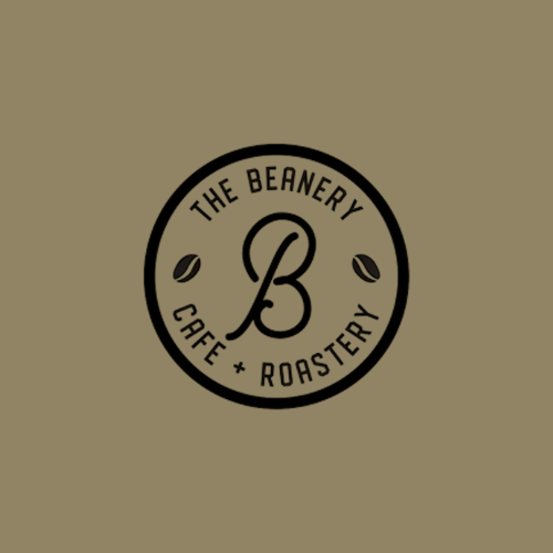 Logo for The Beanery Café + Roastery, featuring a large letter B inside a circle with two small coffee beans on either side.