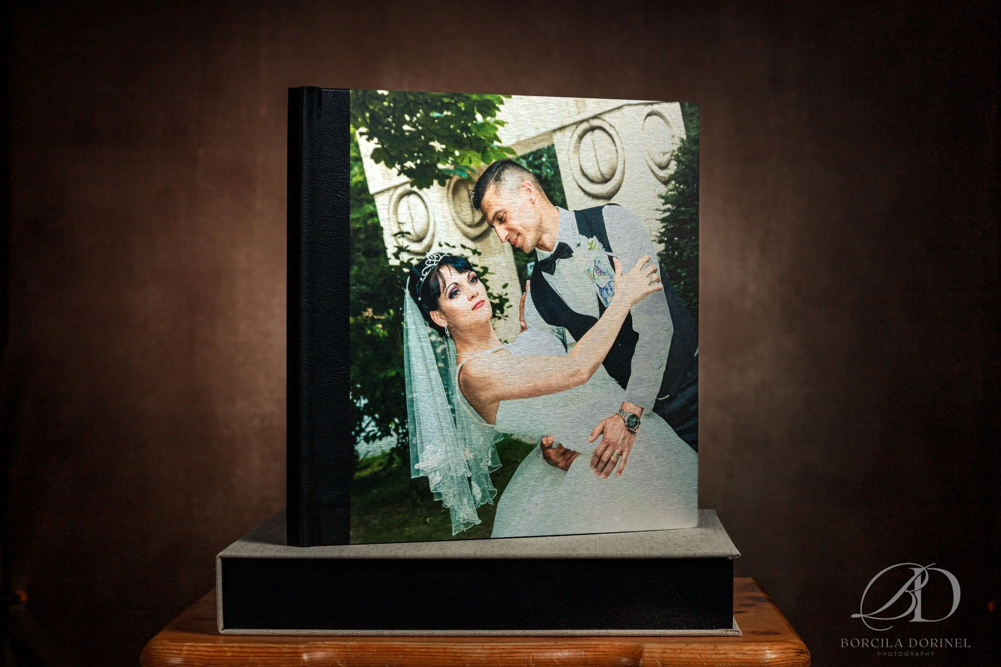 A professional line wedding photo book featuring a bride and groom on the cover, elegantly capturing their special moment captured by borcila dorinel photography wedding photographer northampton