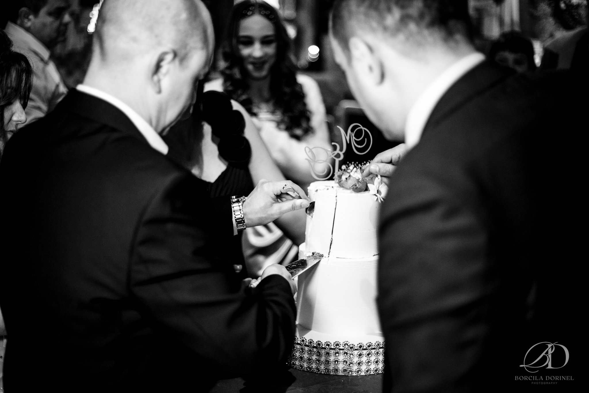 Bride and groom laughing together photographed in documentary wedding style
