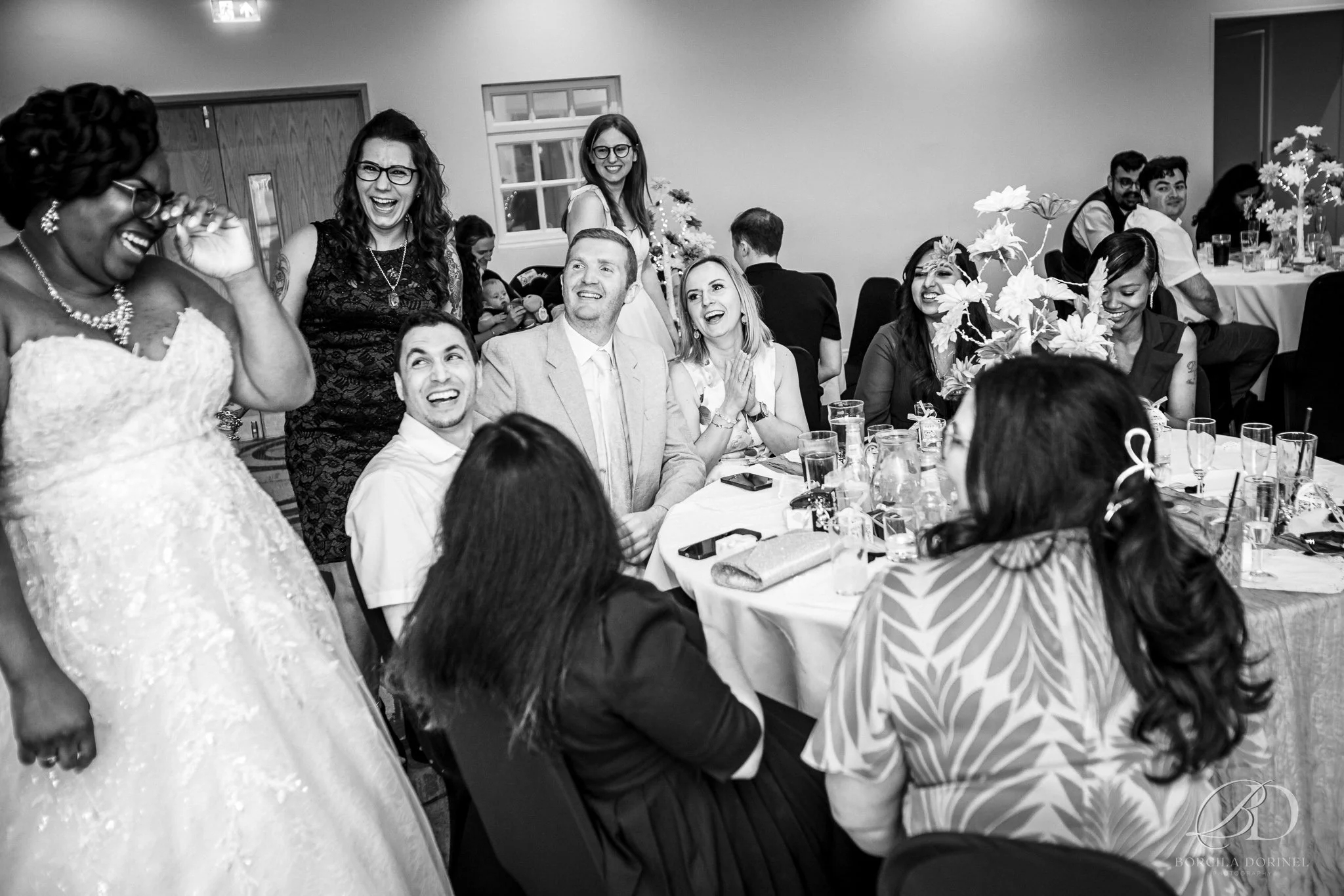 Wedding photography portfolio: bride chatting and laughing with guests and friends at reception captured by borcila dorinel photography documentary wedding photographer in northampton natural storytelling for relaxed couples