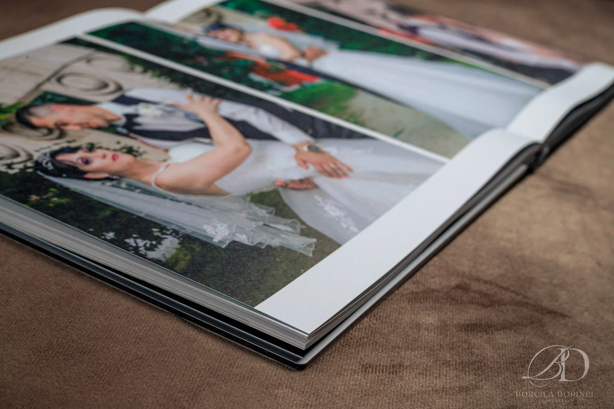 A professional wedding album featuring elegant photos of the bride and groom celebrating their special day.