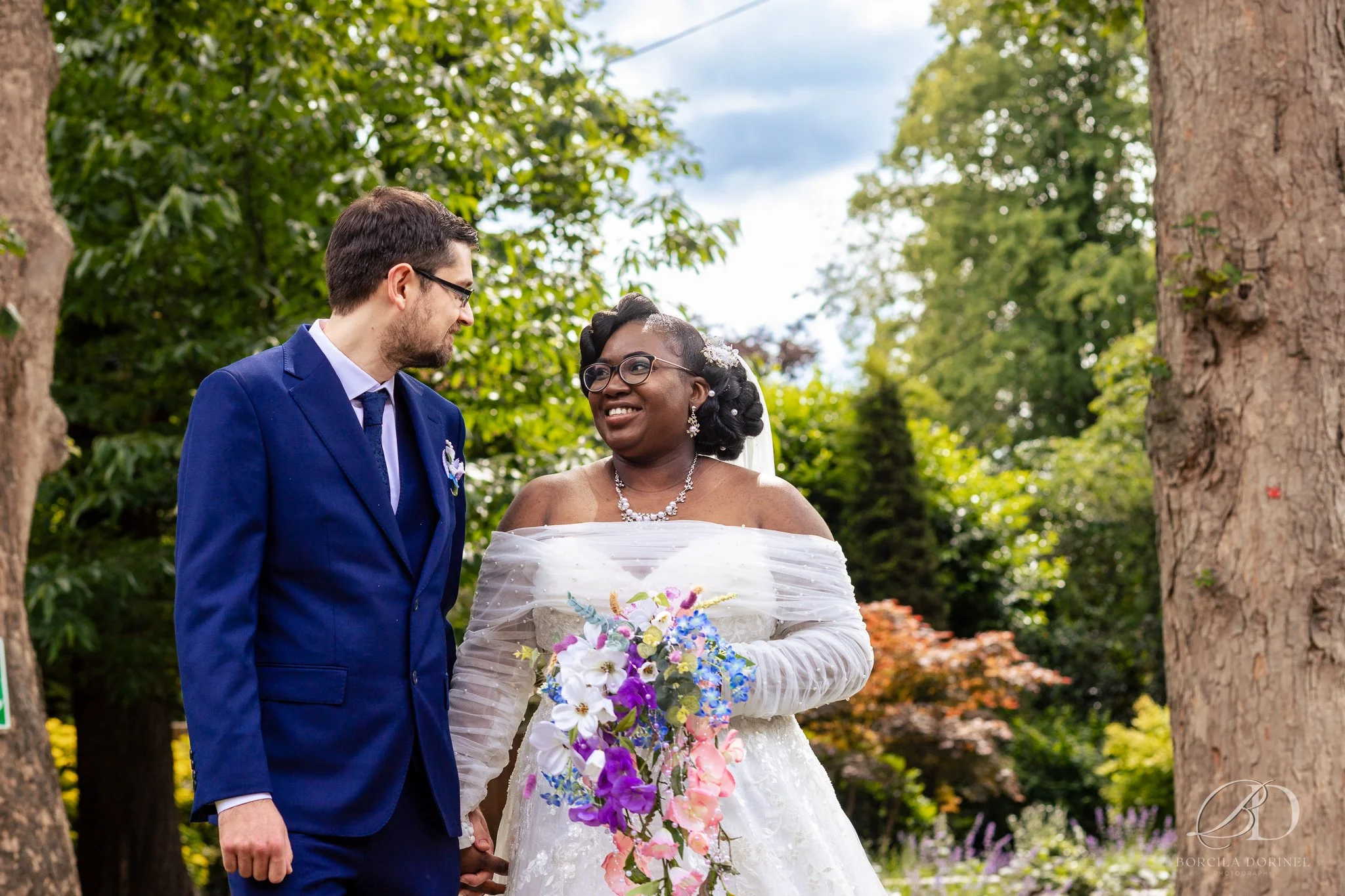 Documentary wedding photographer capturing laughter during wedding breakfast
