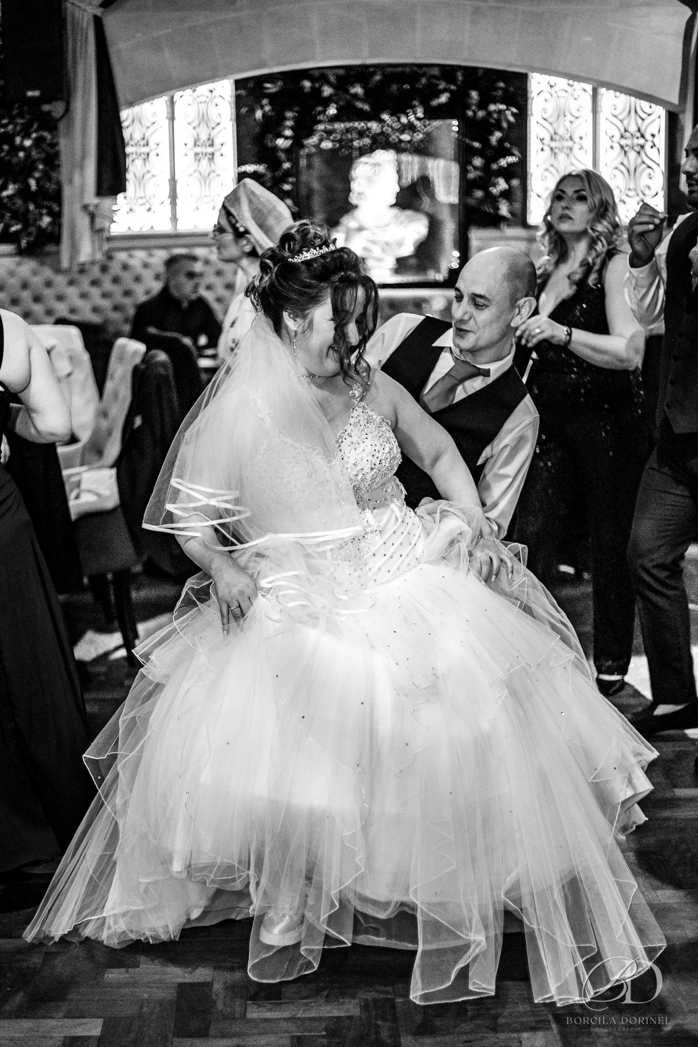 Documentary wedding photographer capturing emotional hug at Northampton wedding

