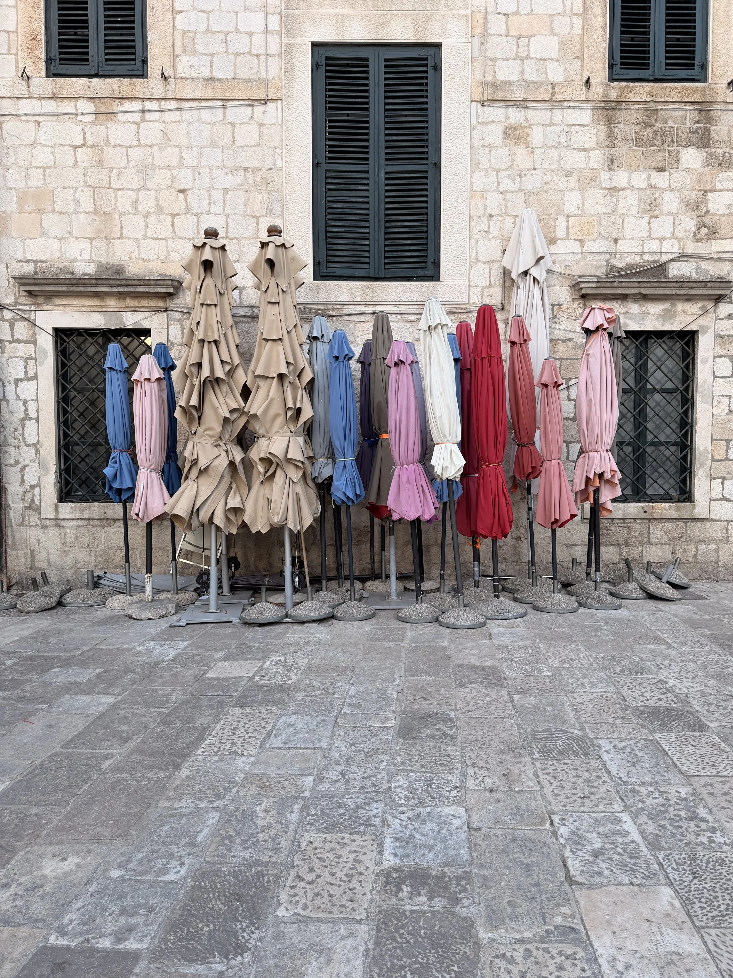 After the busy day, the umbrellas from the daily market are packed away ready for the bustling restaurant's to unpack & set up their tables. What can you let go of, or pack away, so that other dreams and visions can take hold? 