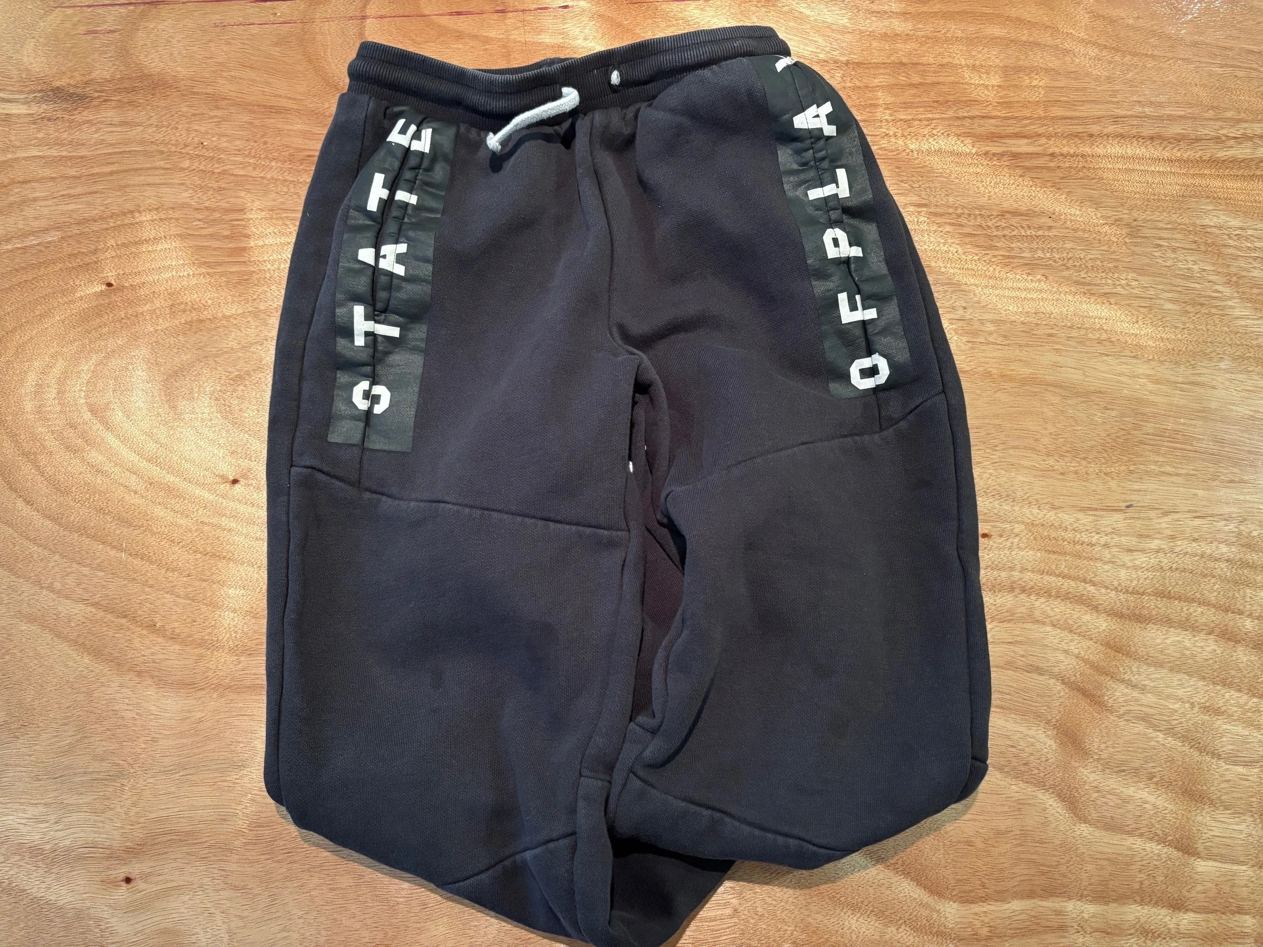 Child's black tracksuit bottoms  ?date/place