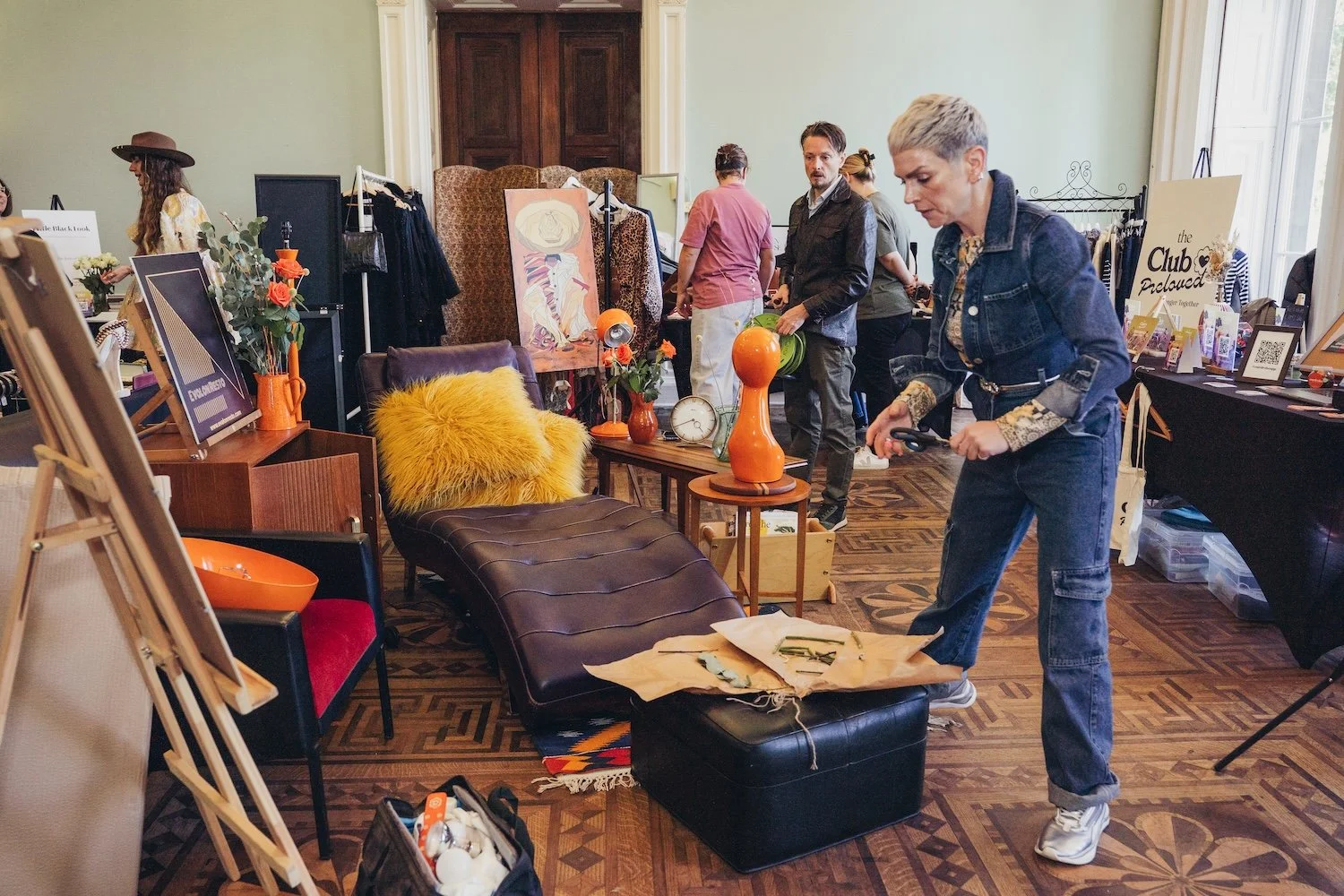 People browsing at the preloved shopping experience  at a She's Electric event 