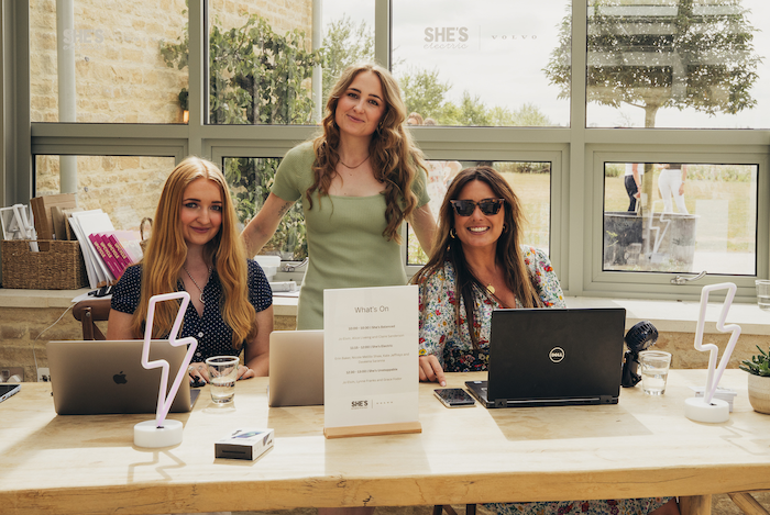 Still Curious team at event registration deck