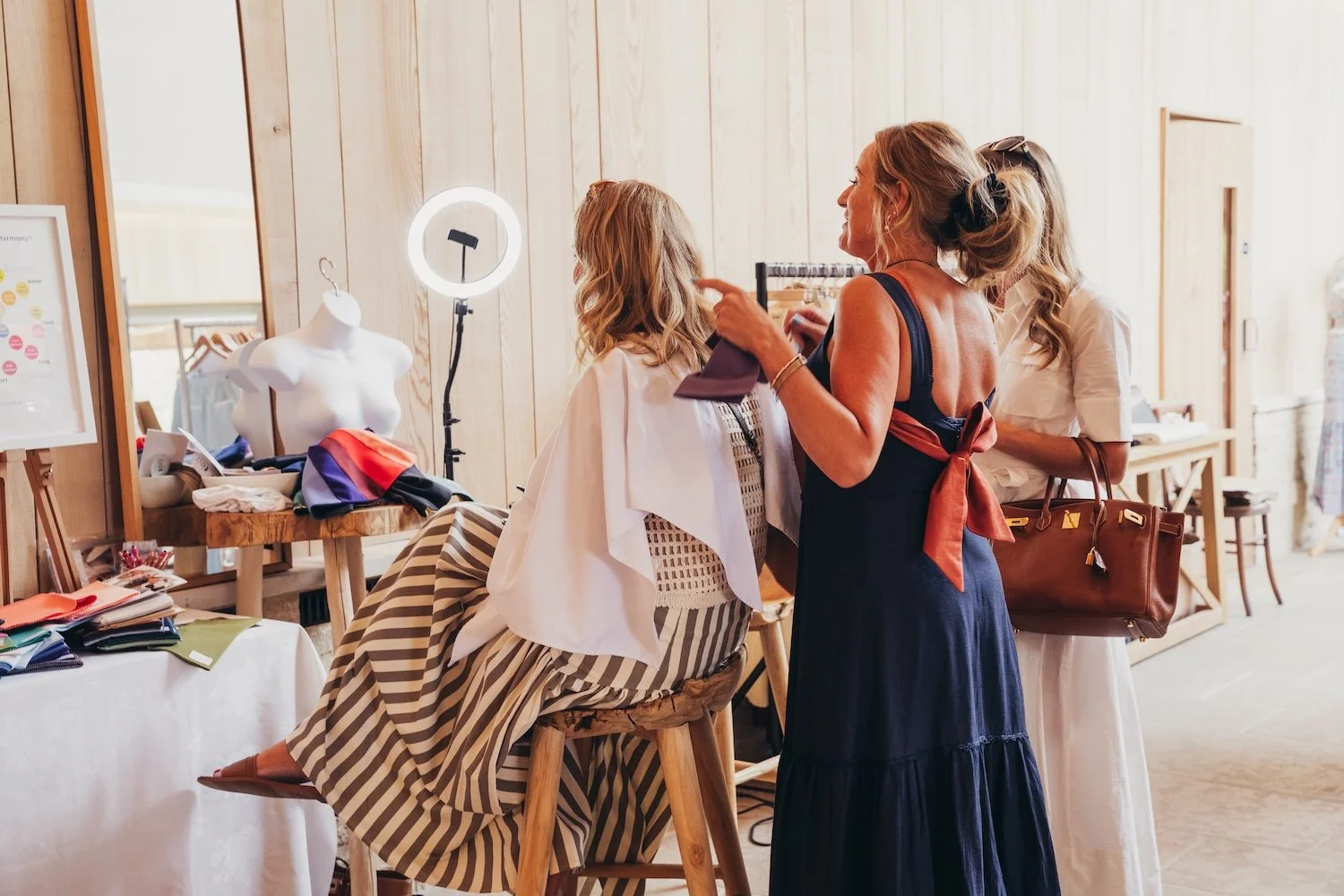 Women getting colours done and styled at a She's Electric