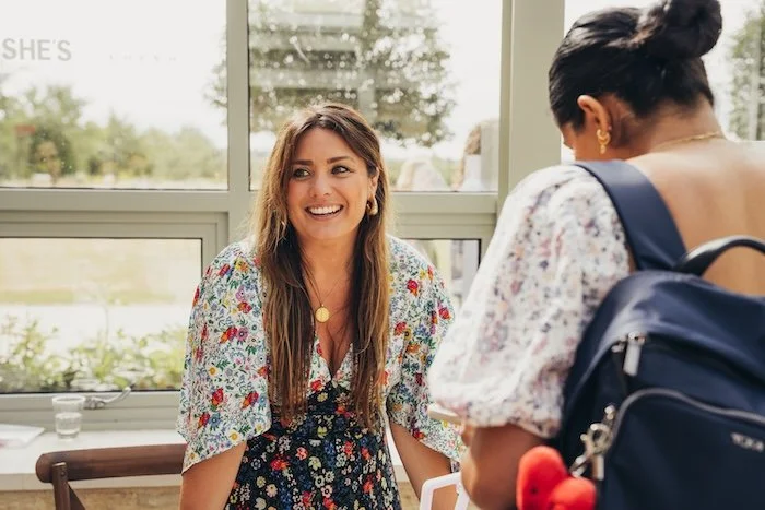 women at event smiling