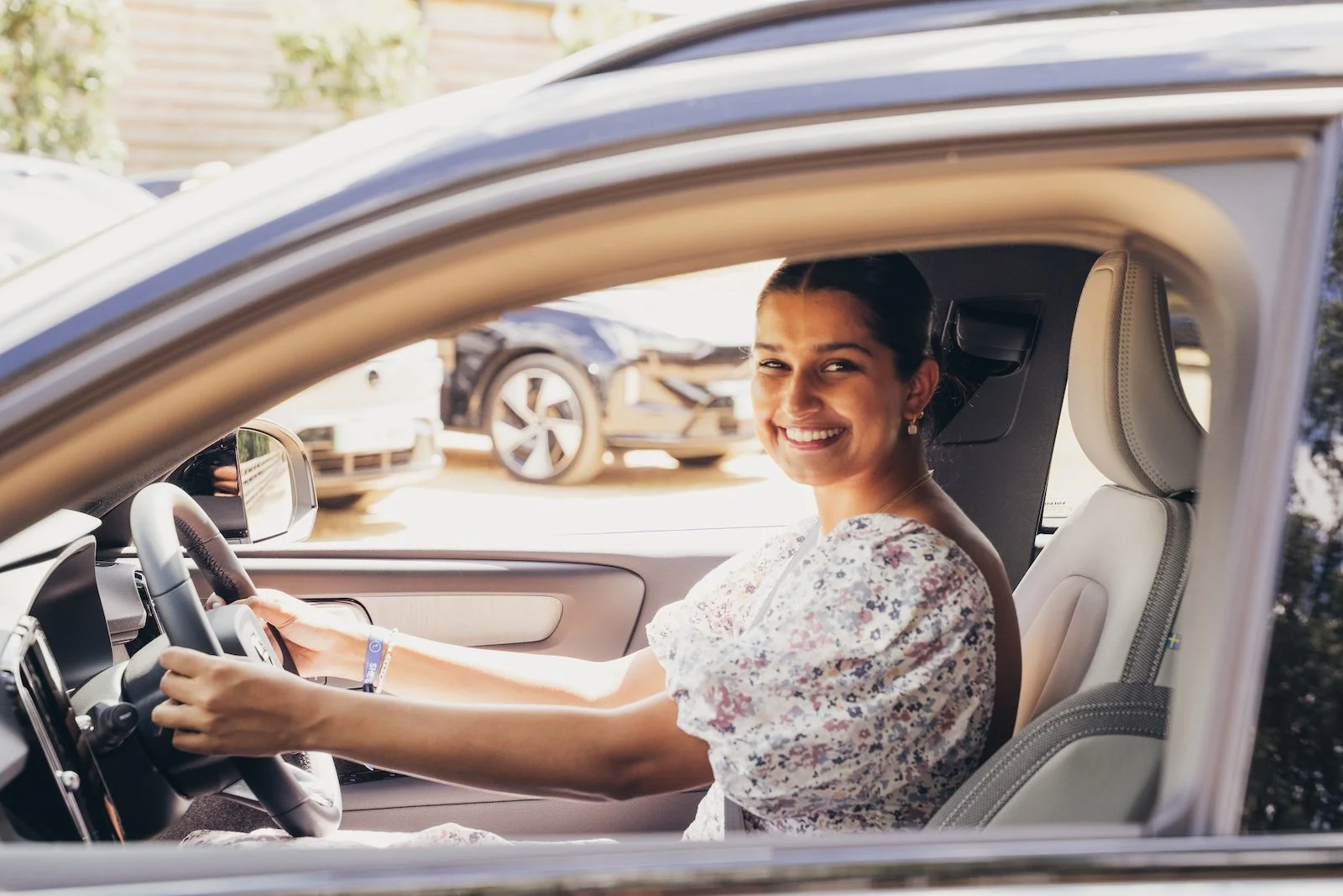 woman test driving a Volvo electric car