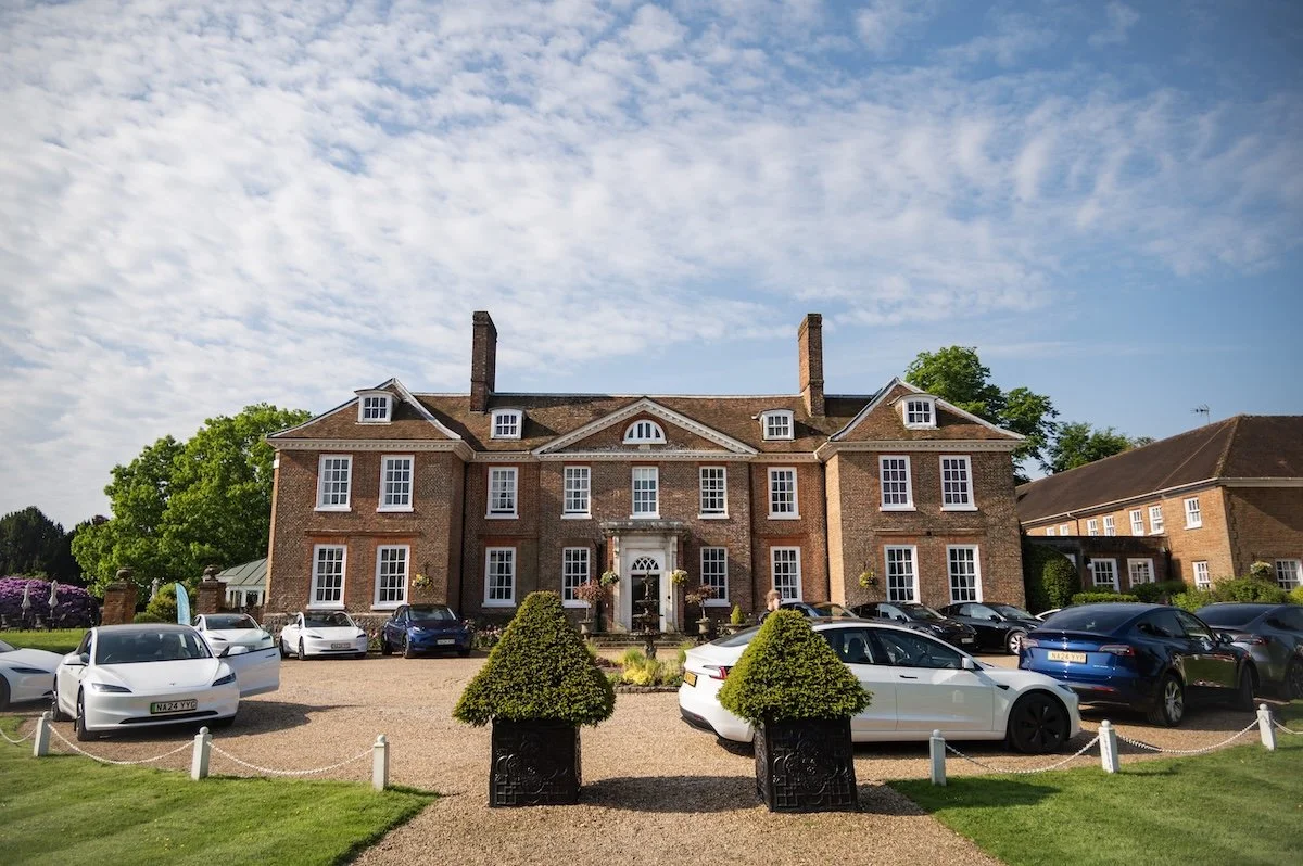 Chilston Park Hotel exterior, surrounded by a gravel driveway with parked evs