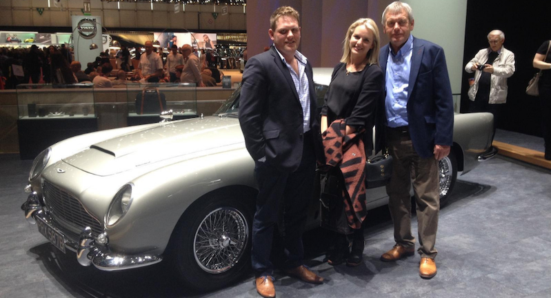 Rebecca Day and family standing next to an Aston Martin