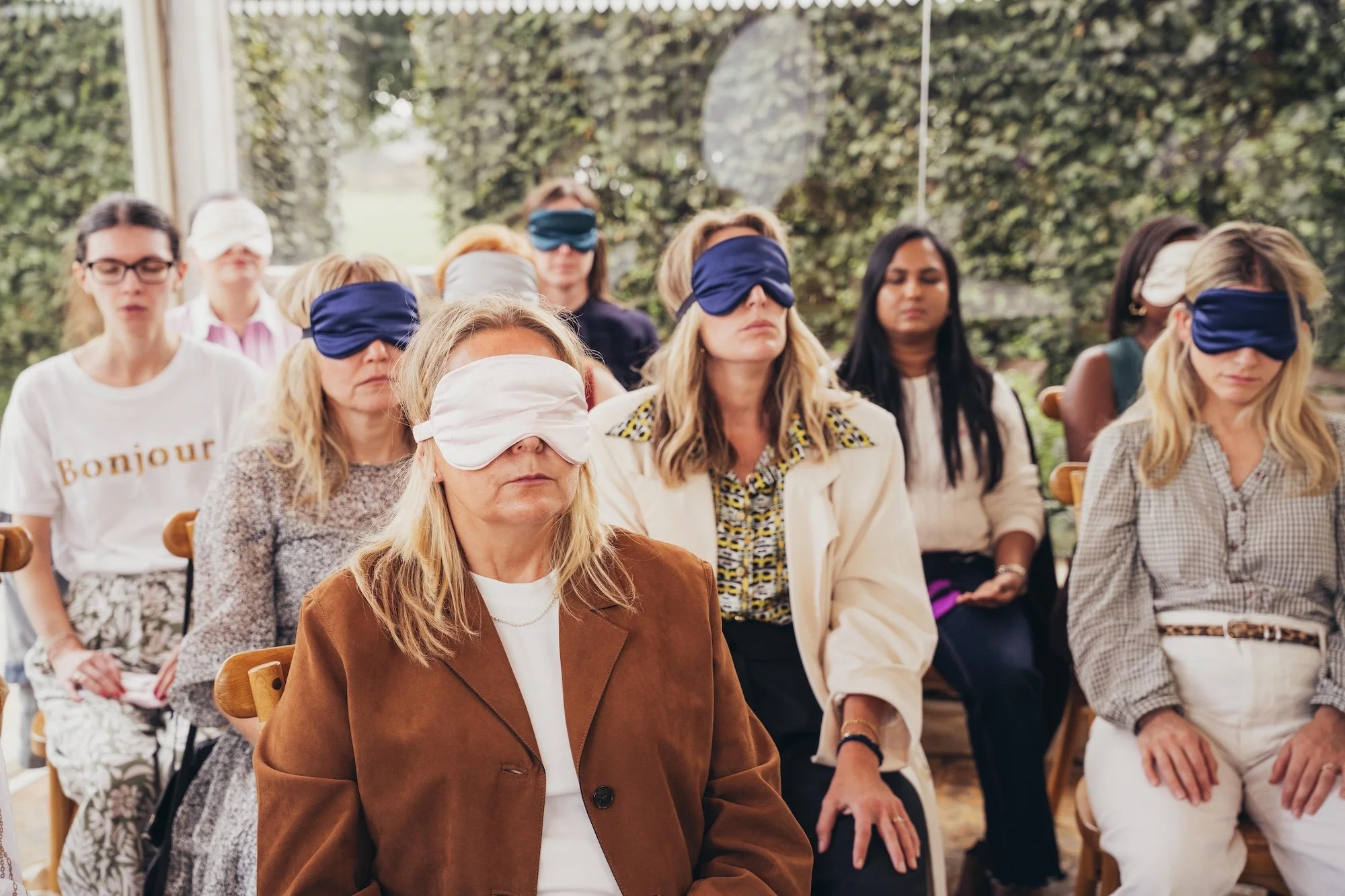 Women blindfolded for a breathwork session