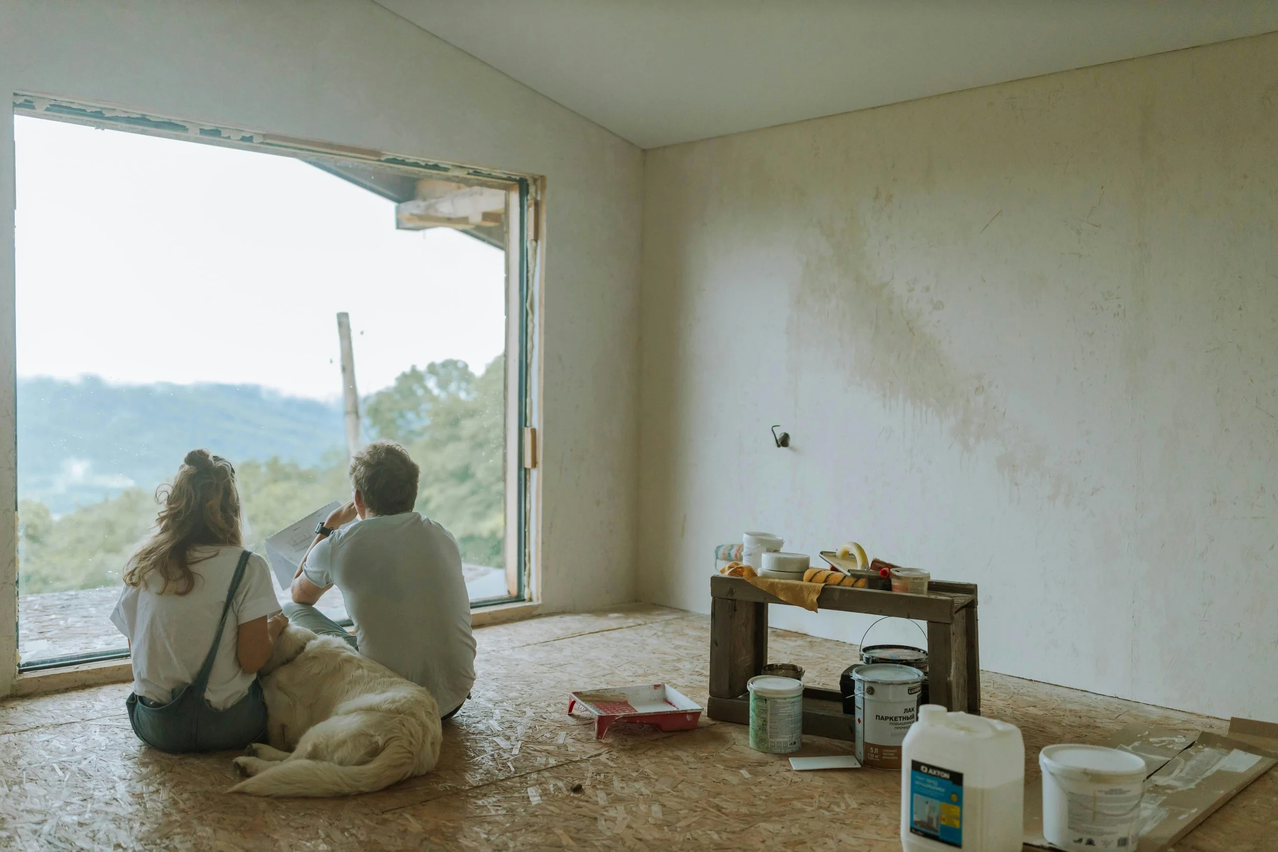 Homeowners in Hertfordshire sitting and discussing renovation plans