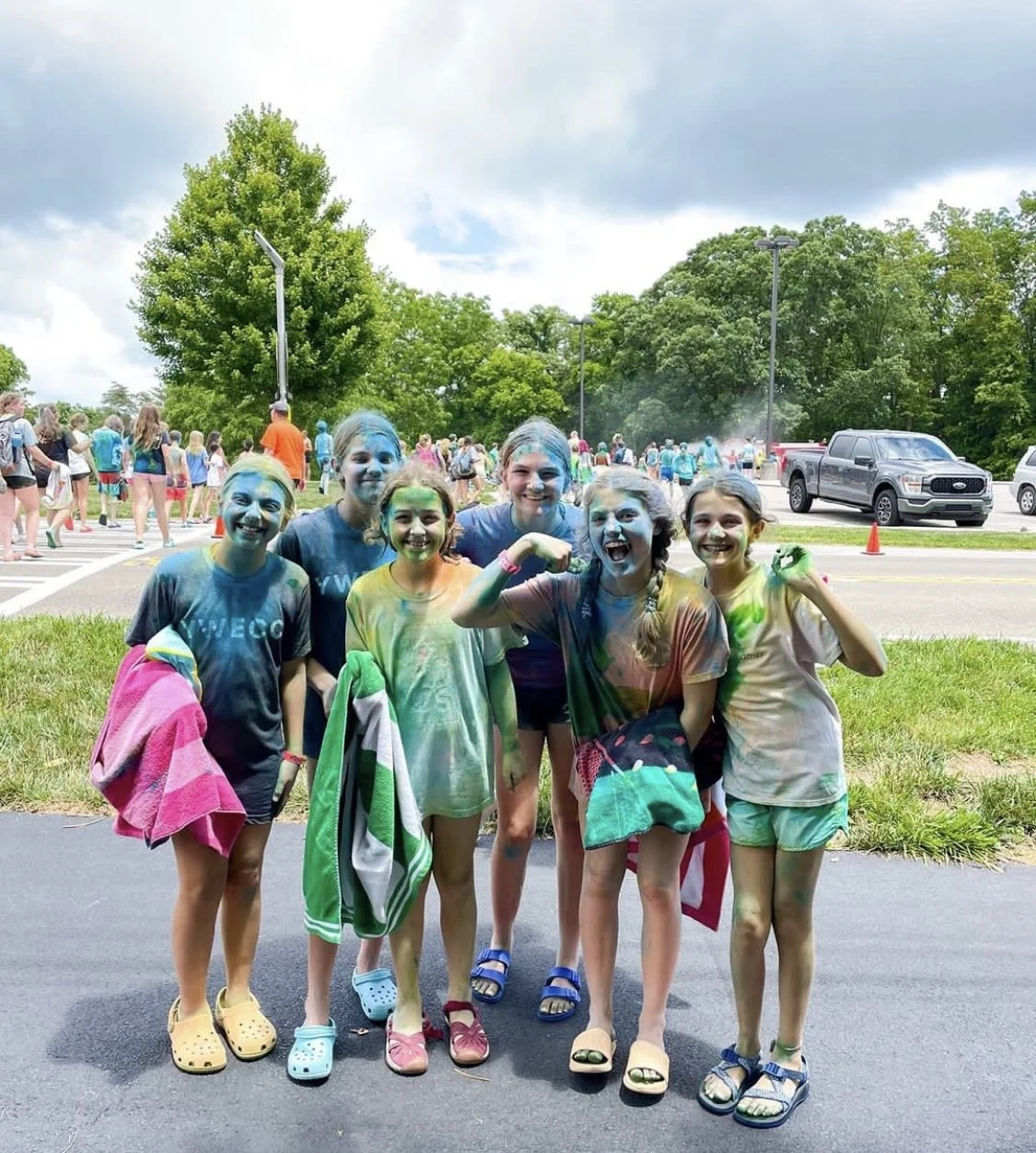 4 girls smiling at a charity "Color Run"