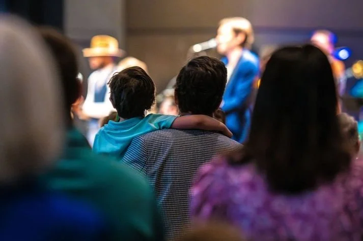 Brett Taylor leading a Sunday Morning Bible Study in the Hanger Building