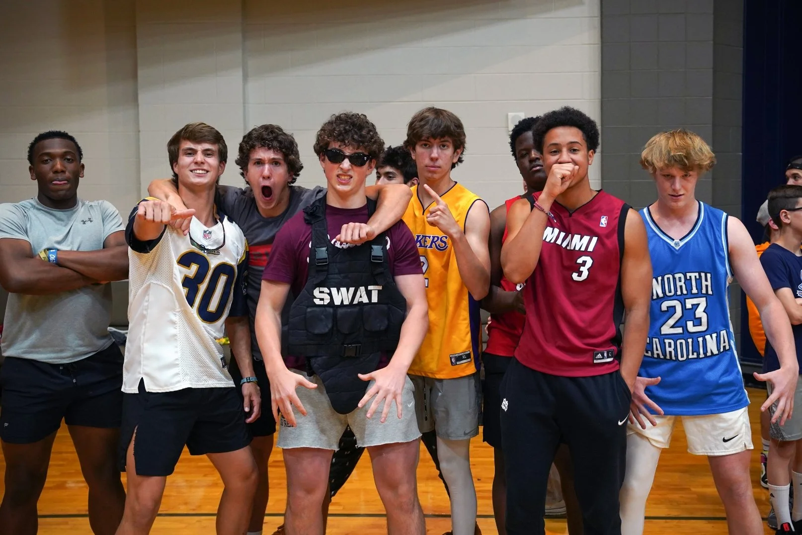 Dodgeball team of highschoolers strike an intimidating pose before their game.