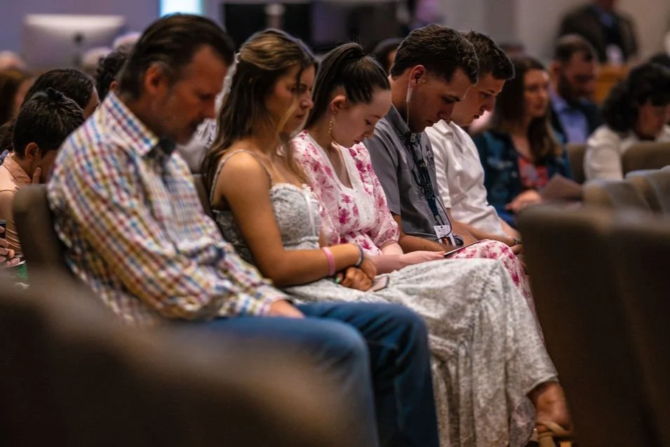 People laugh while entering West End for Good Friday Service