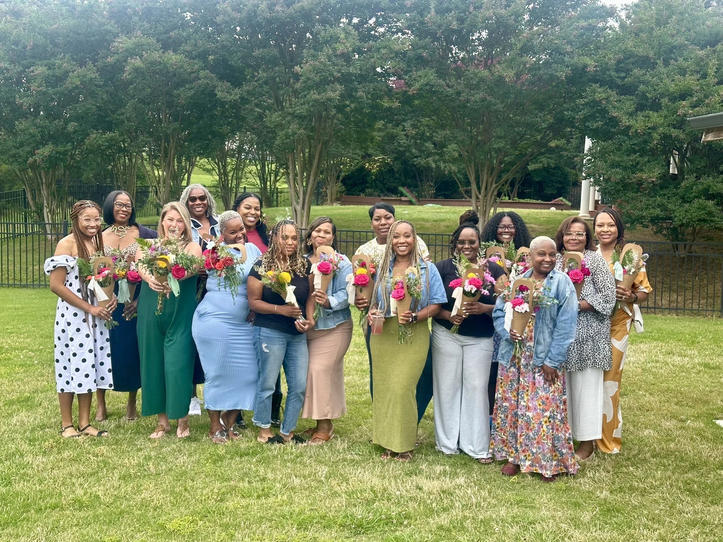 Group of happy women holding bouquets of flowers in charlotte north carolina