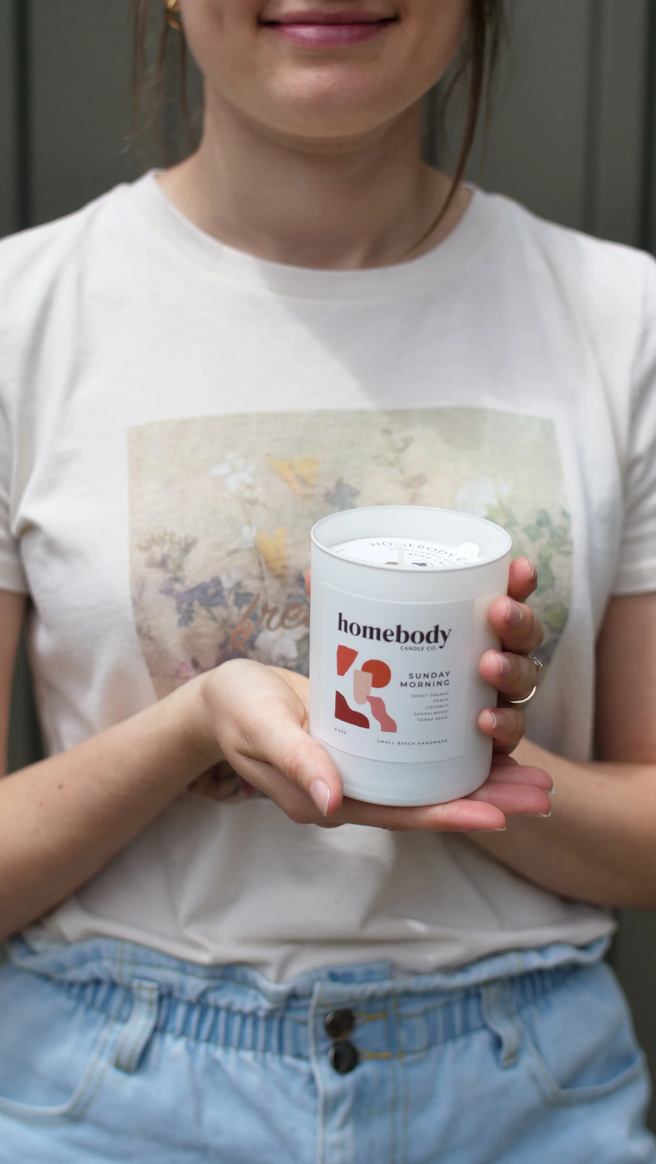 Two hands holding a candle