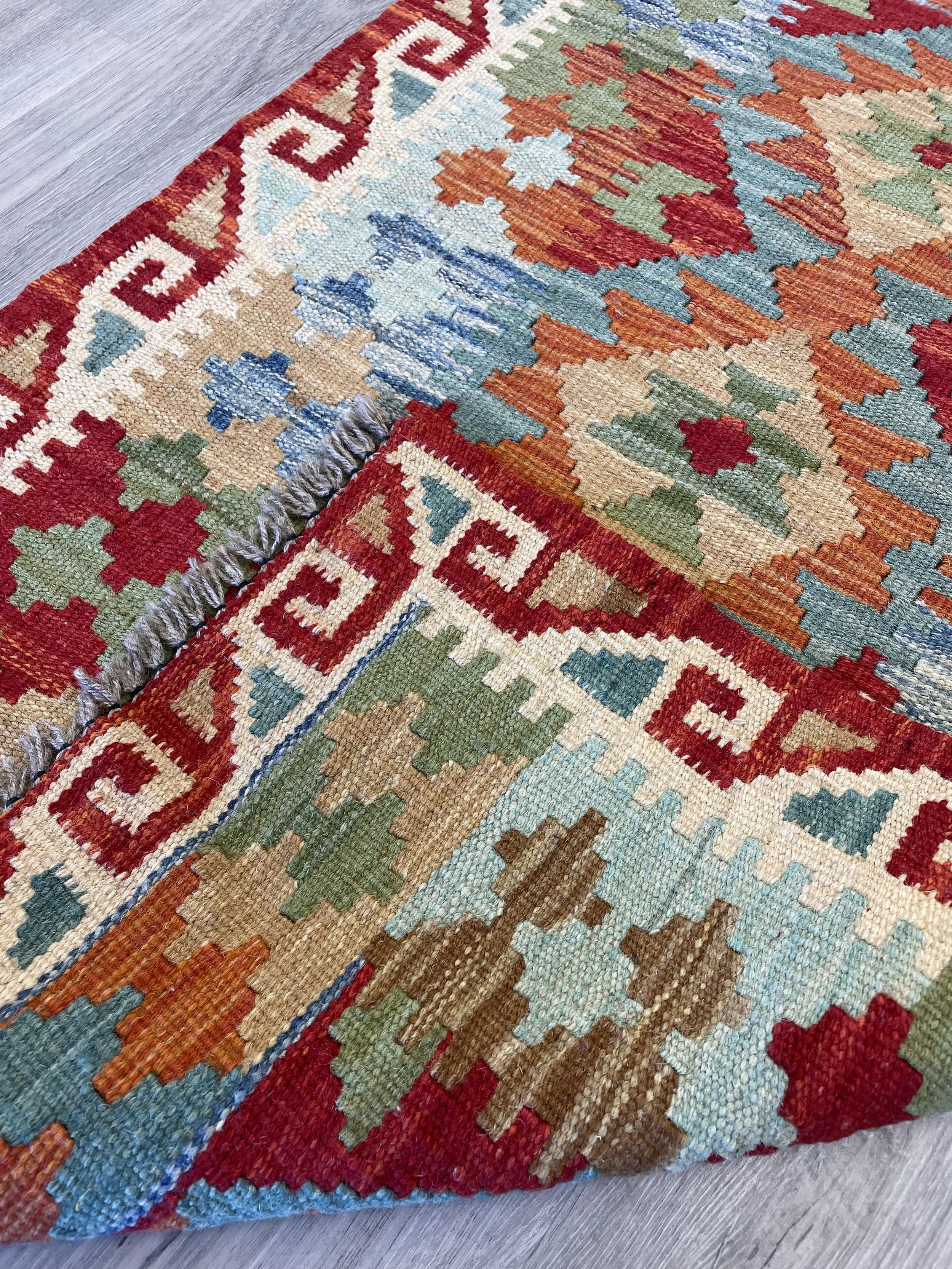A colourful hand-woven 2x3 kilim rug