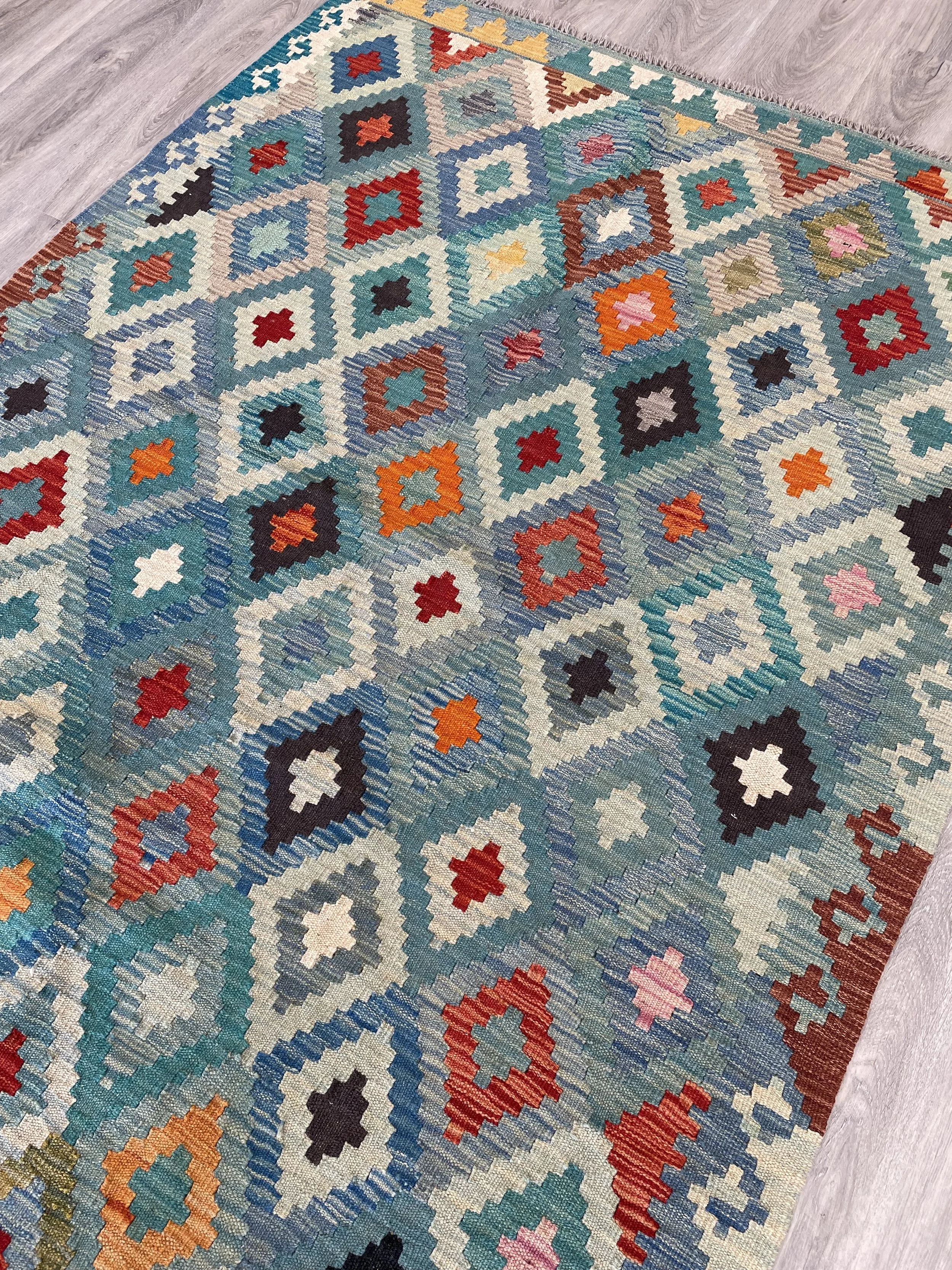 A colourful hand-woven 4x6 kilim rug